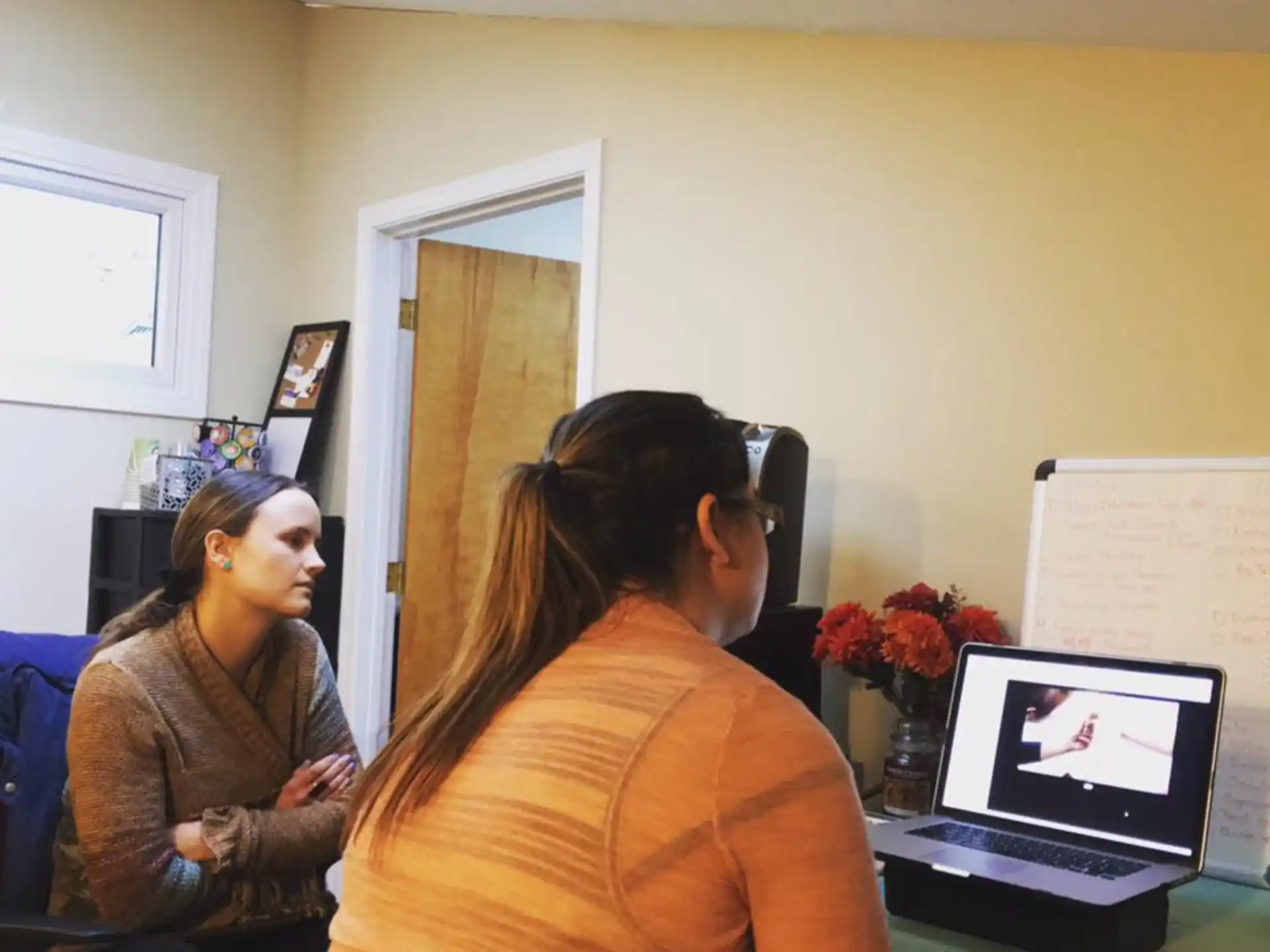a woman talking to another woman