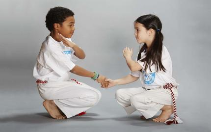 a man and a woman kneeling on the ground