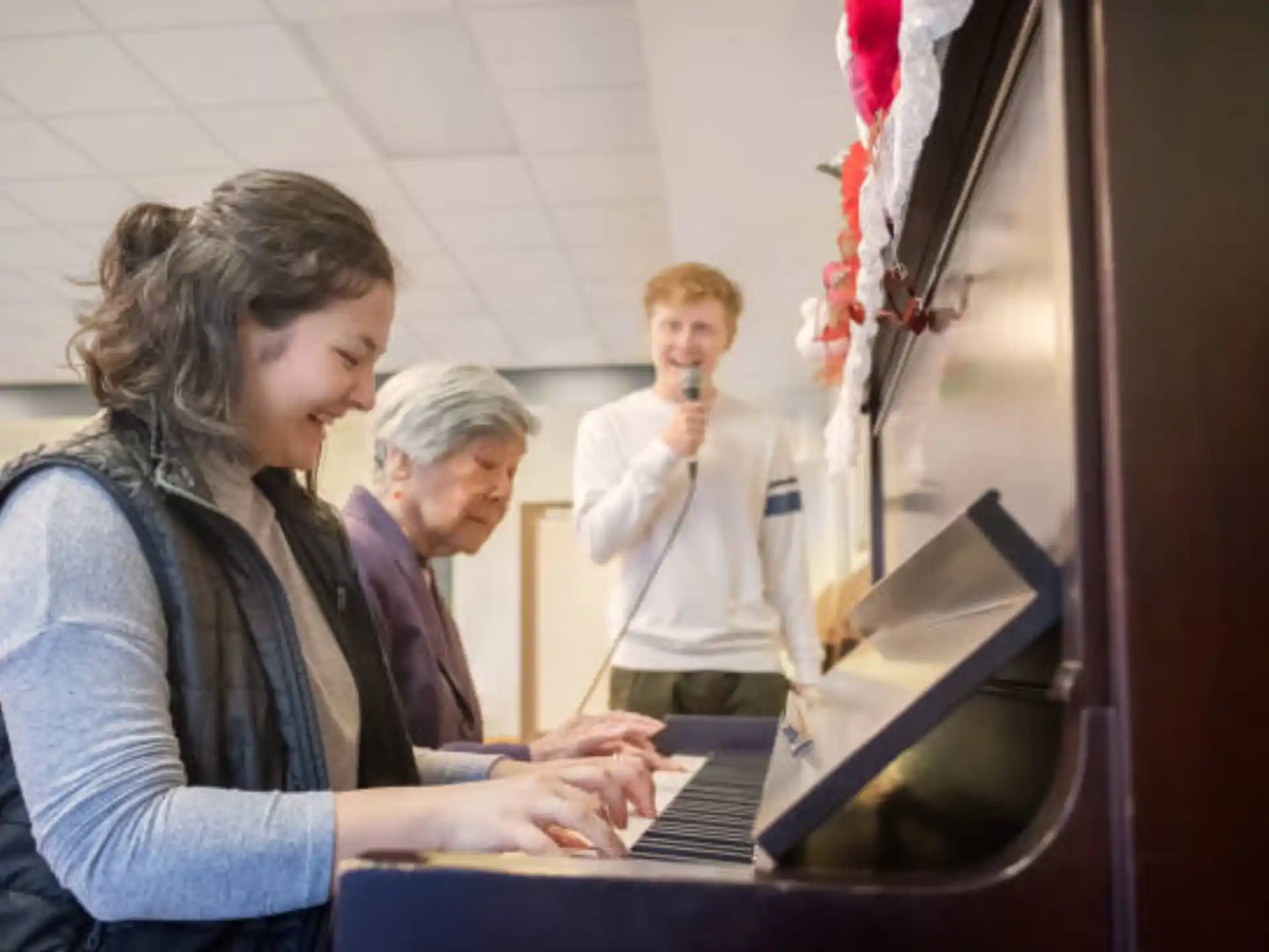 a group of people looking at a laptop