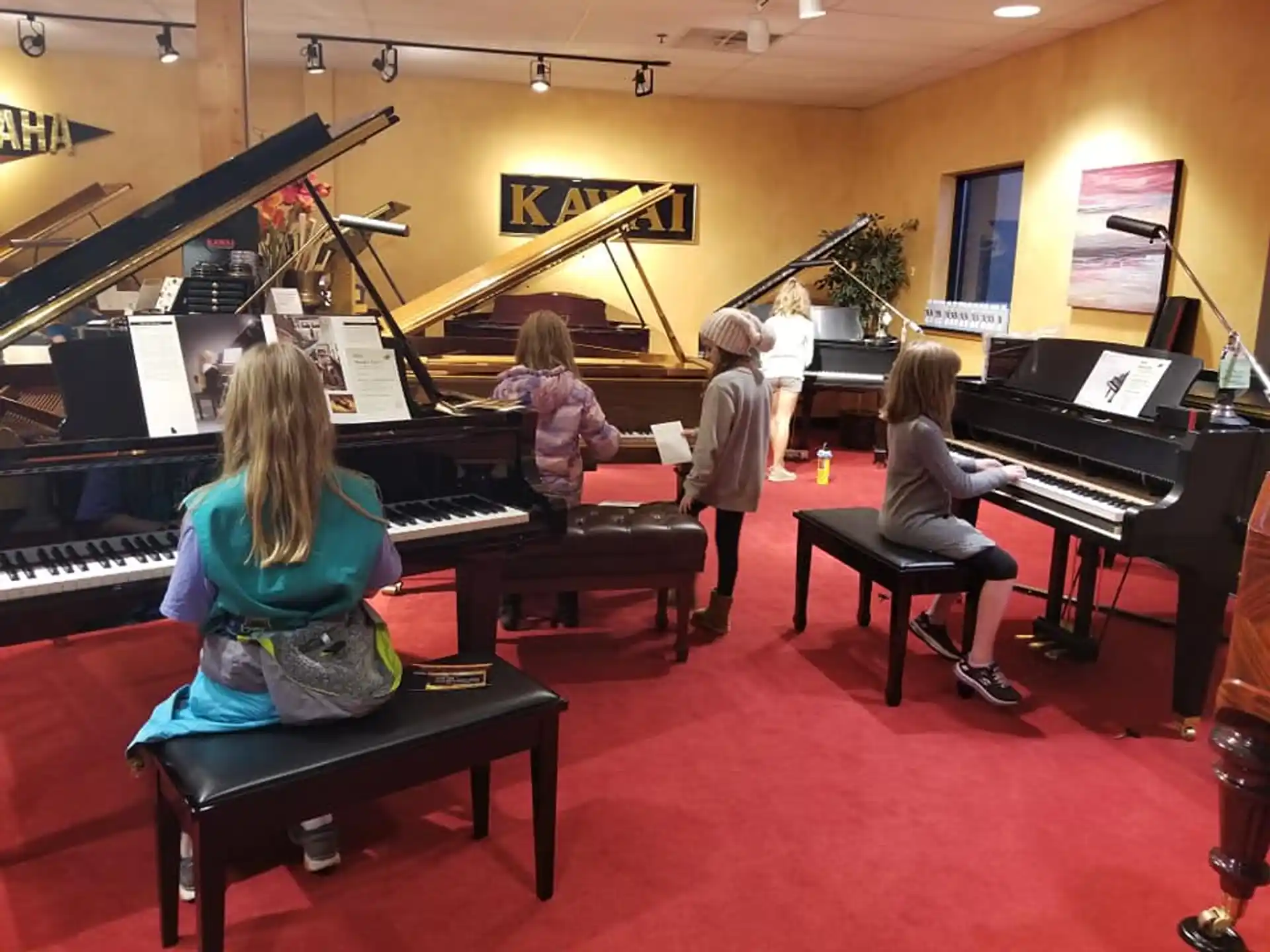 a group of people playing piano