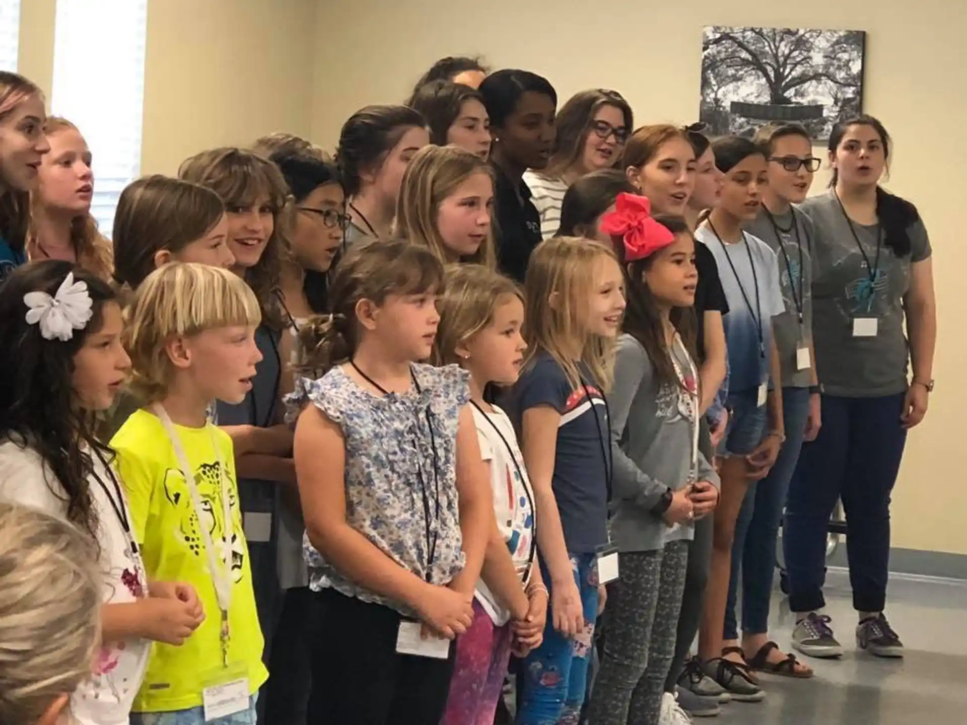 a group of children standing in a room