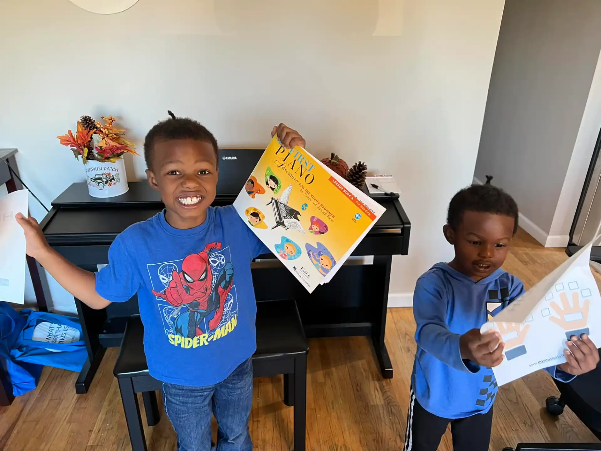 a couple of boys holding a book