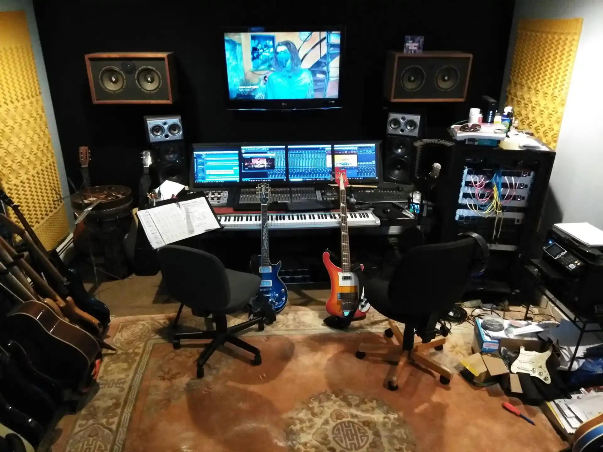 a room with a computer and speakers