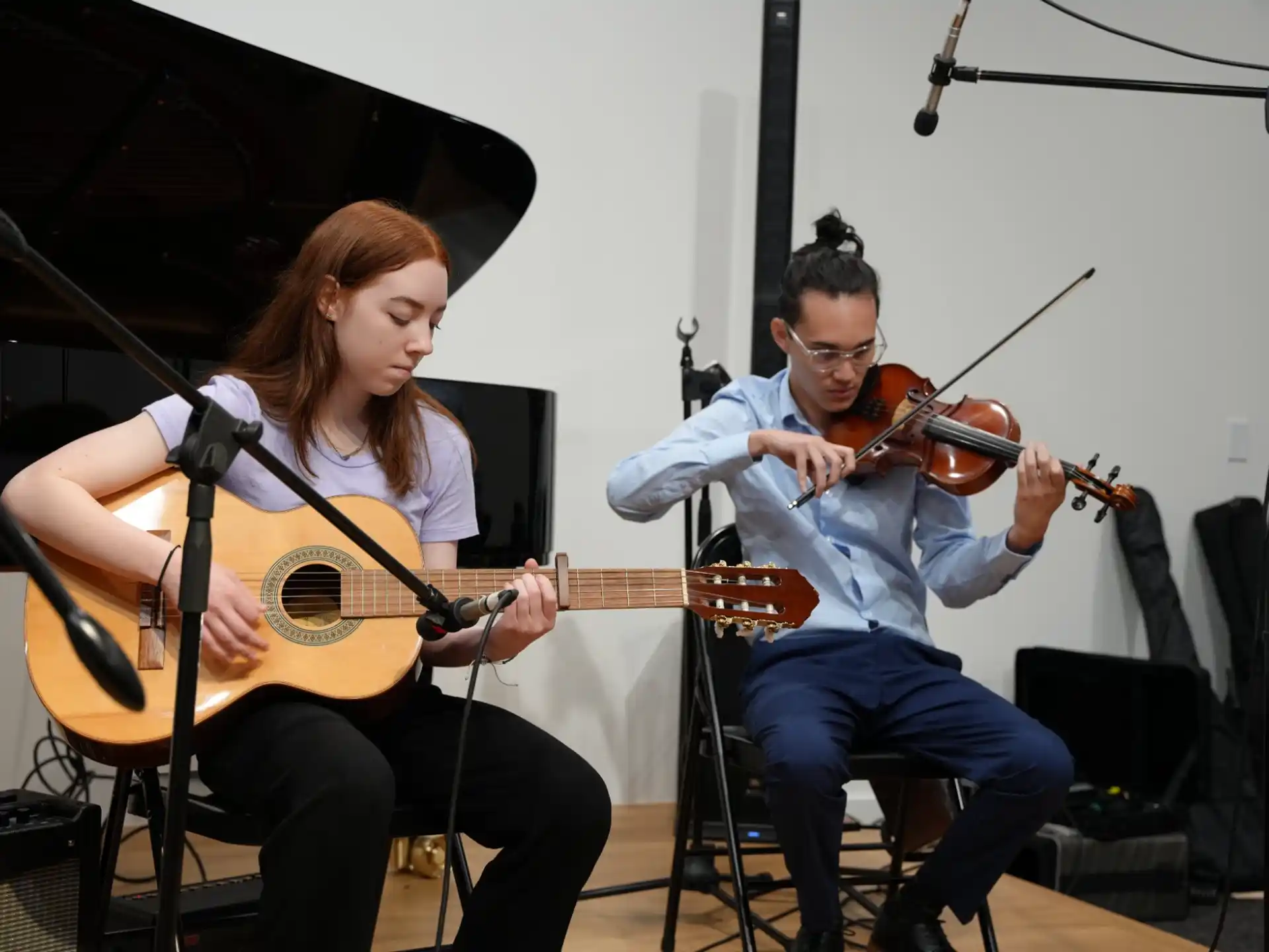 a man and a woman playing instruments
