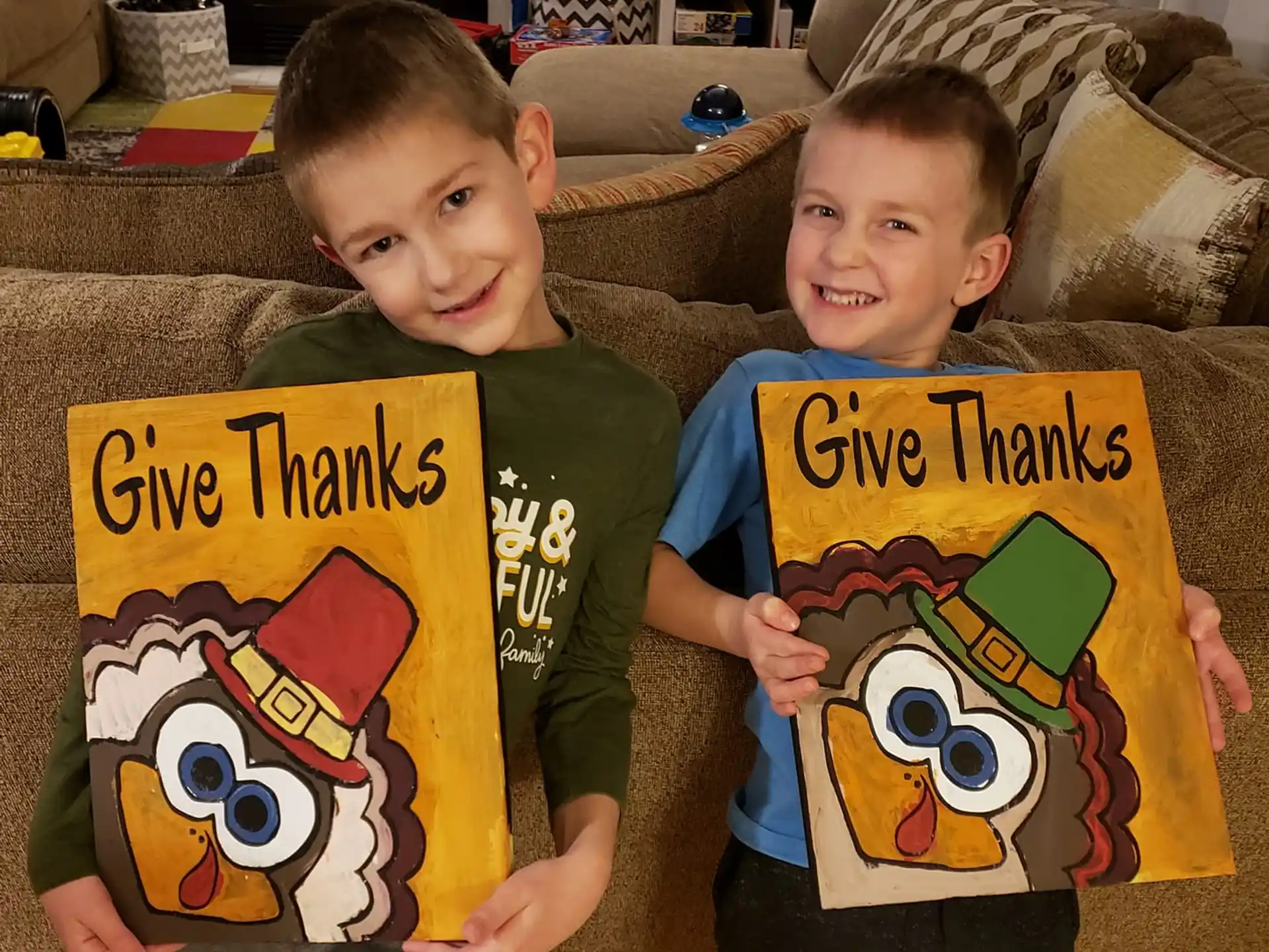 two boys holding yellow signs