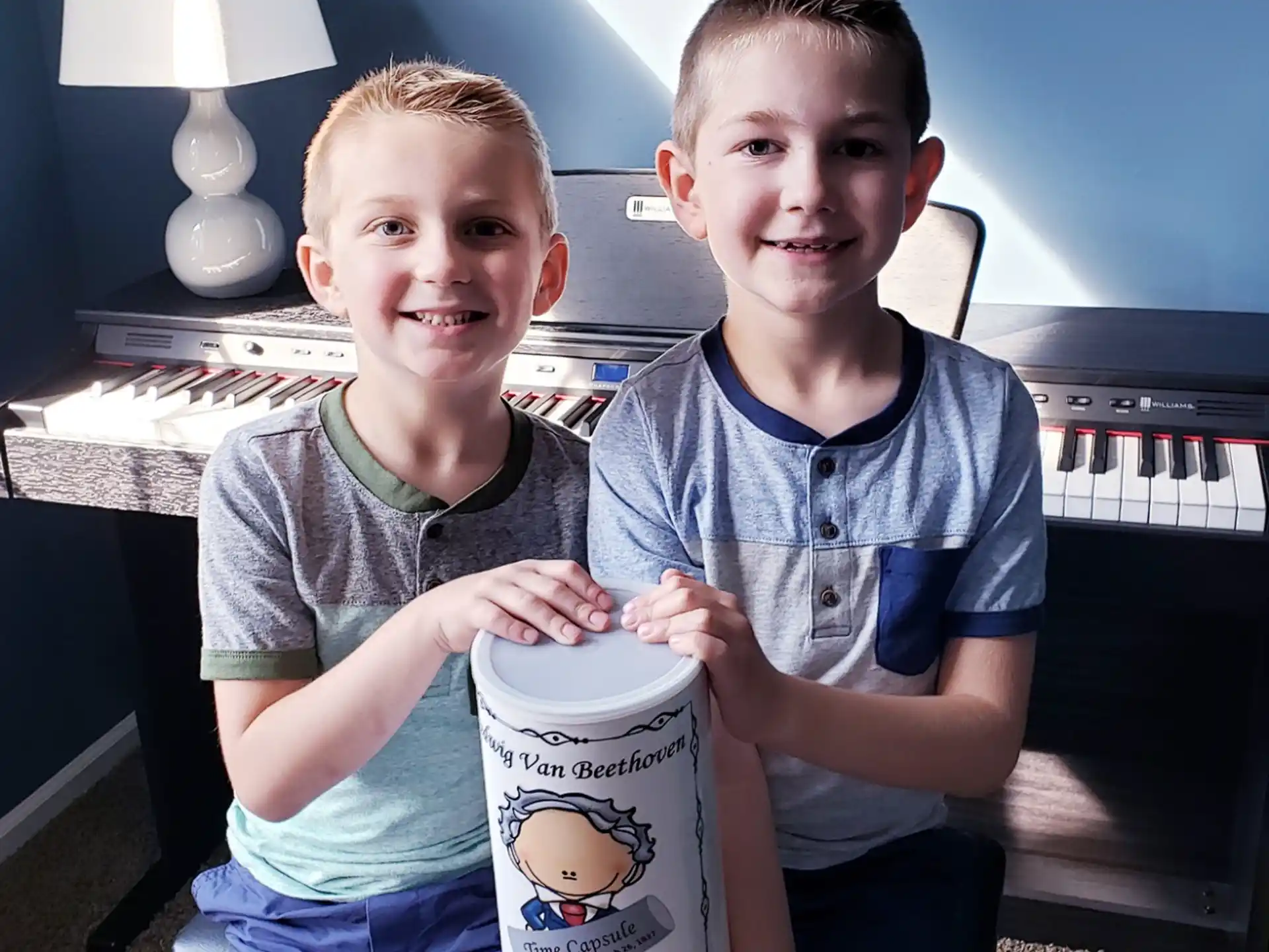 two boys sitting on a couch