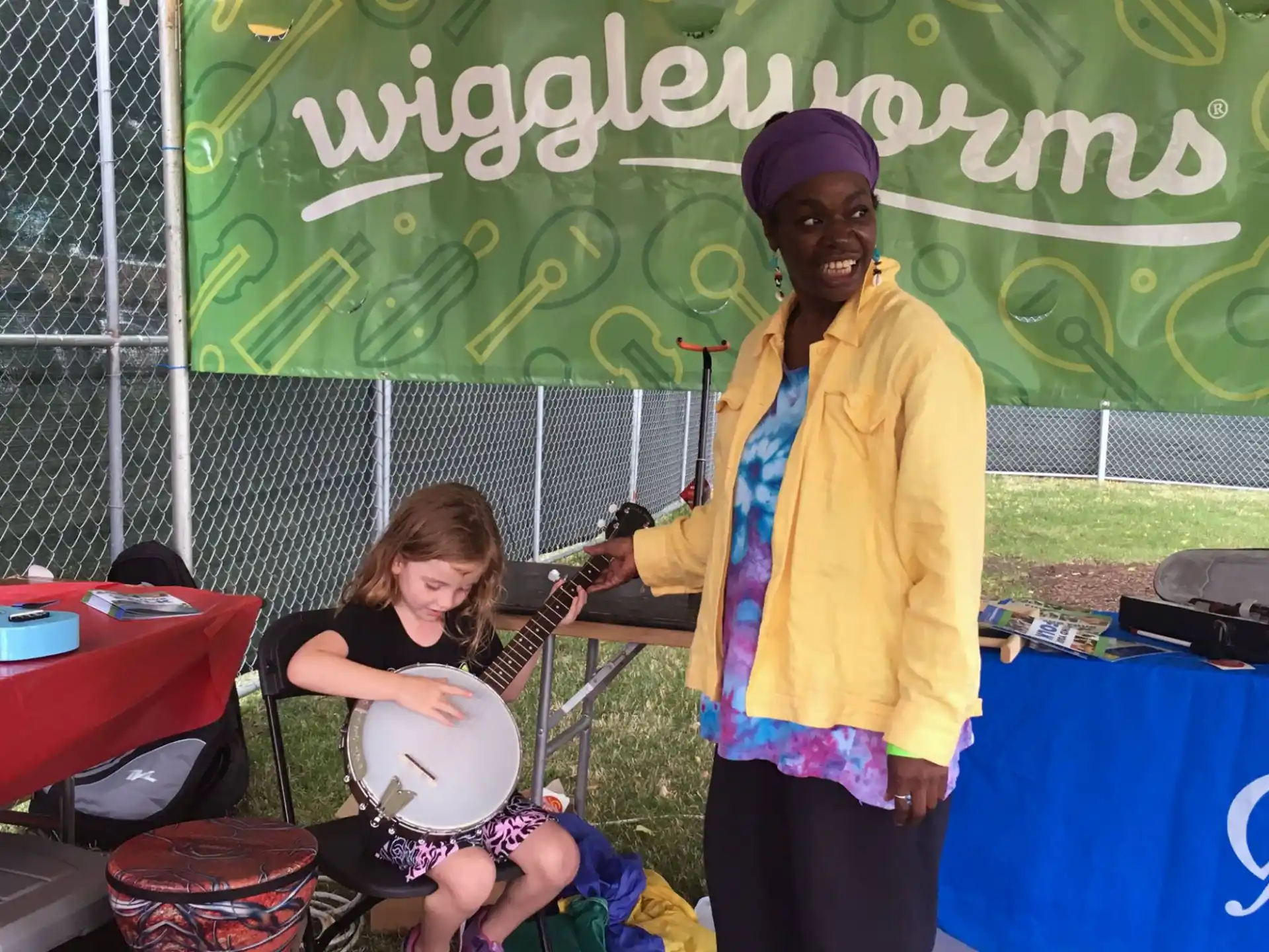 a person and a girl playing instruments