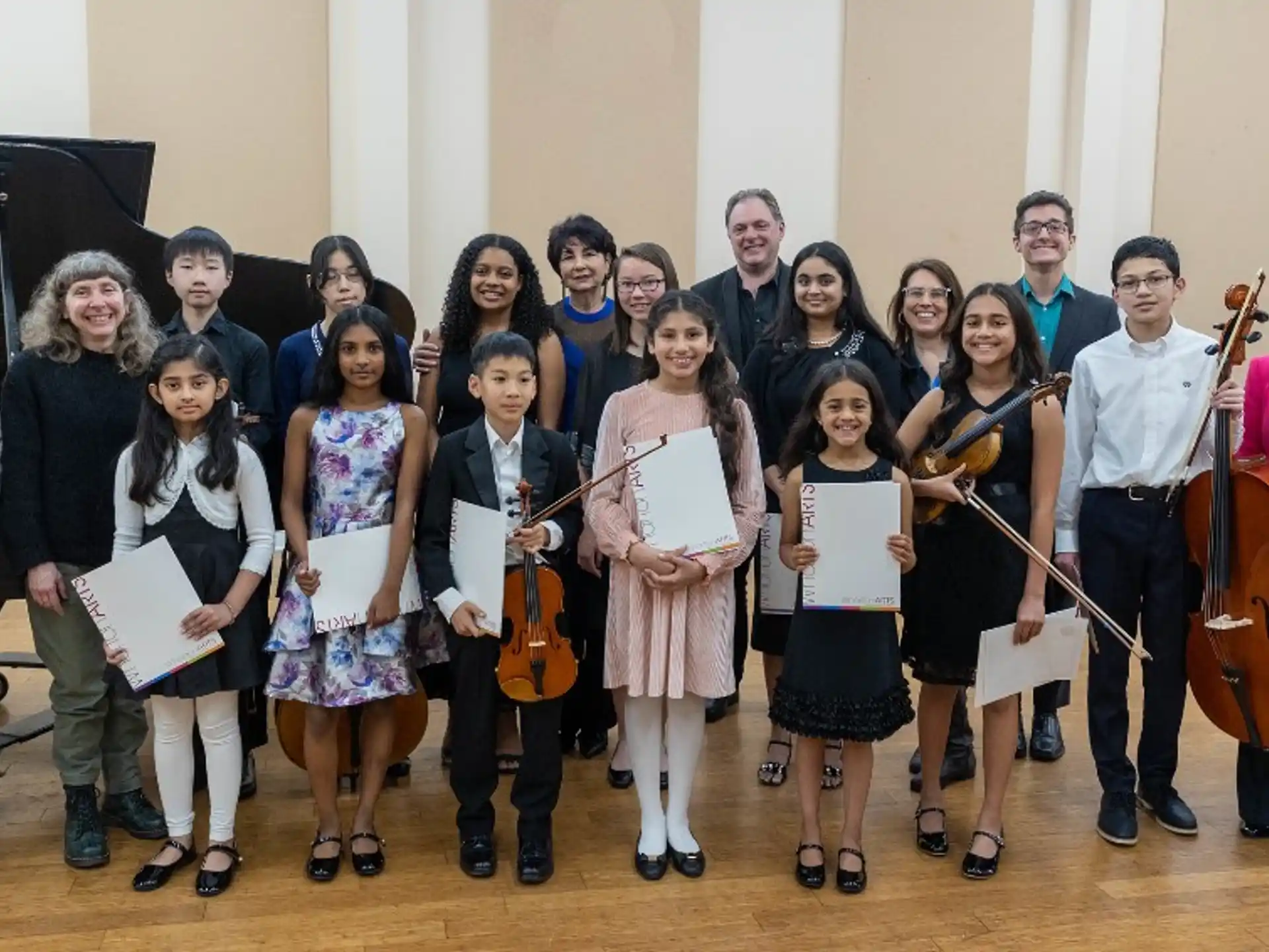 a group of people holding musical instruments