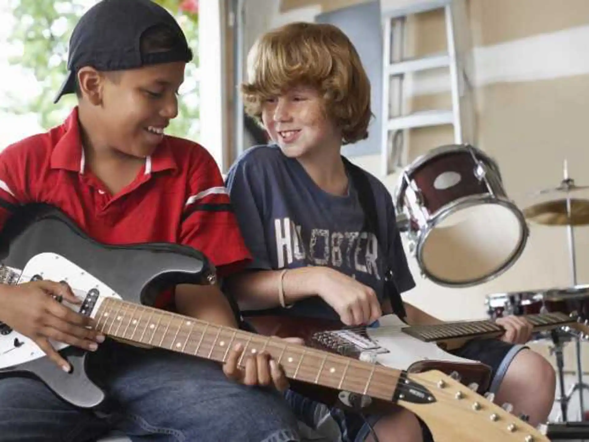 a man and a woman playing guitar