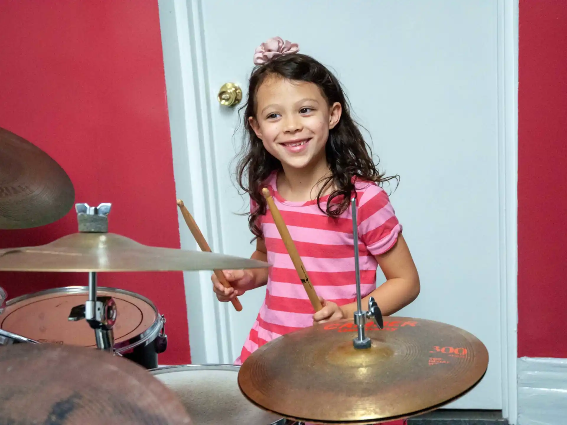 a girl playing drums