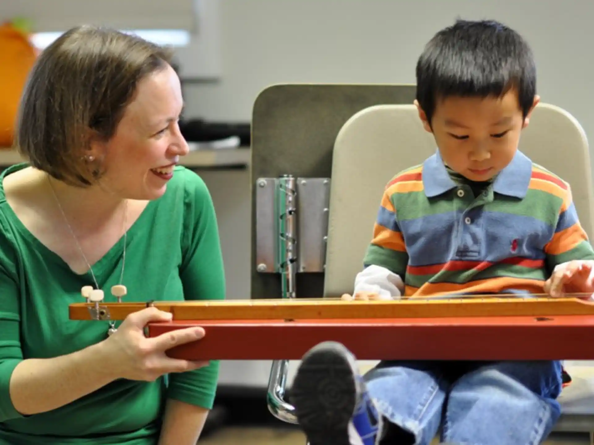 a person and a child sitting at a table