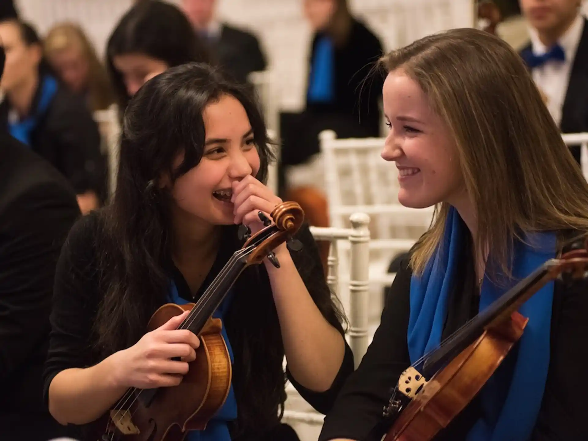 a couple of women playing instruments