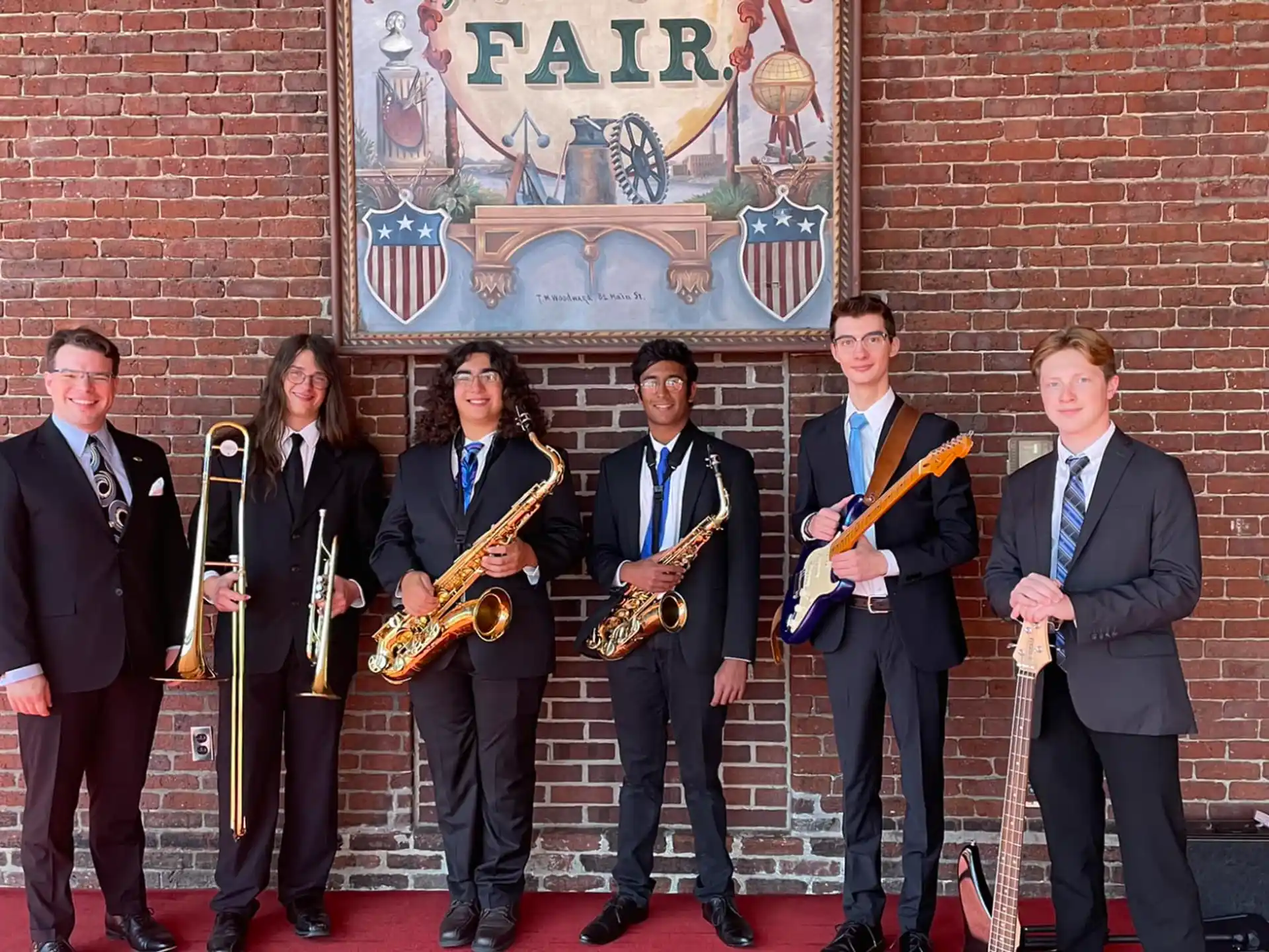 a group of people holding musical instruments