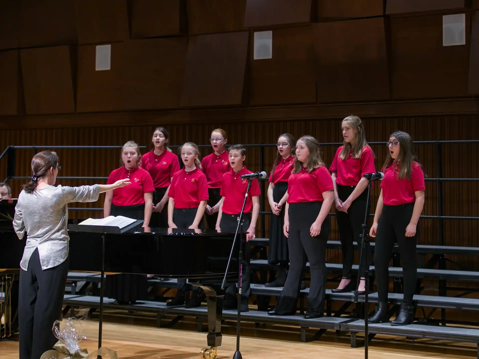 a group of women standing on a stage