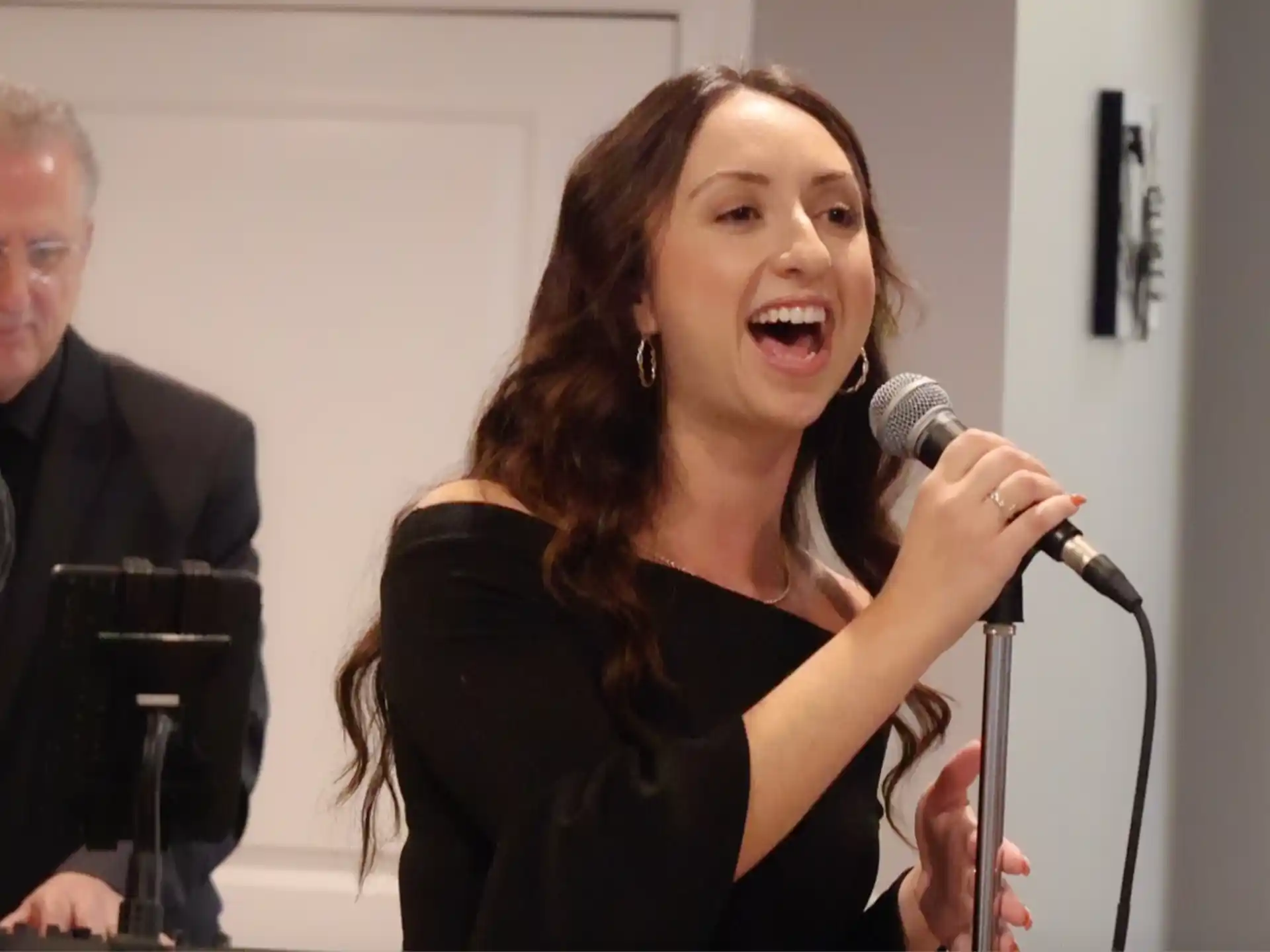 a woman speaking into a microphone