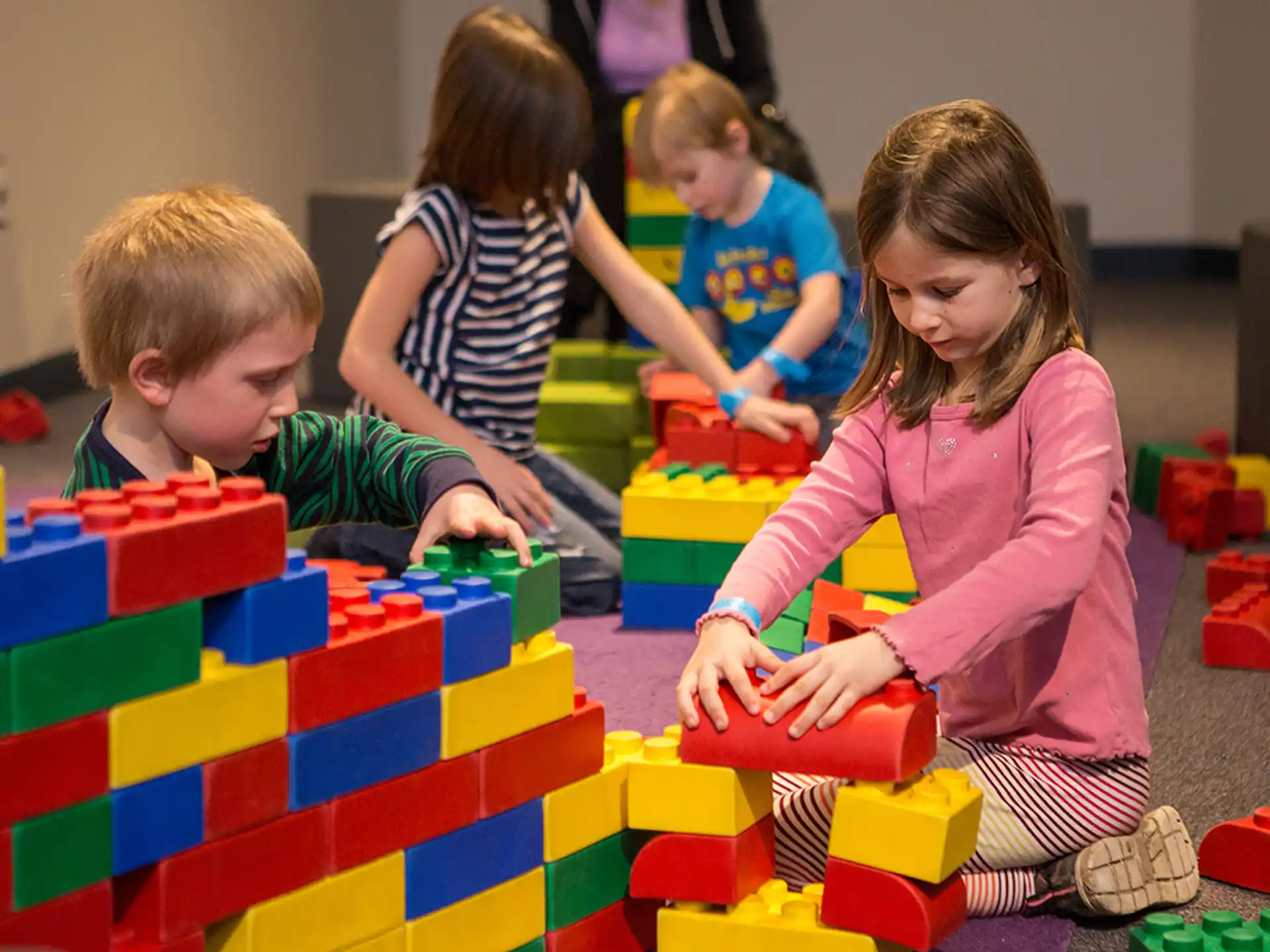 a group of children playing with toys