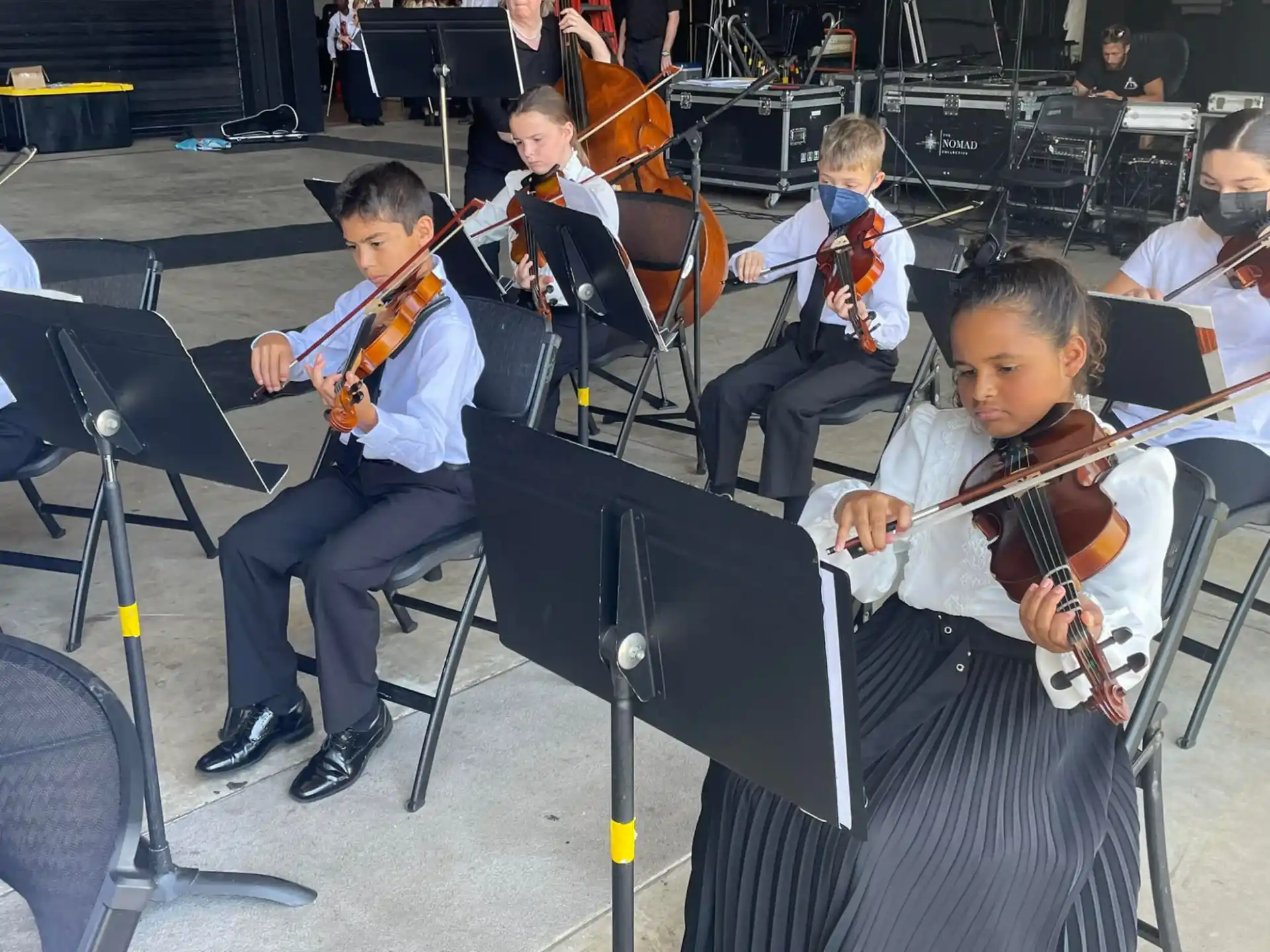 a group of kids playing instruments