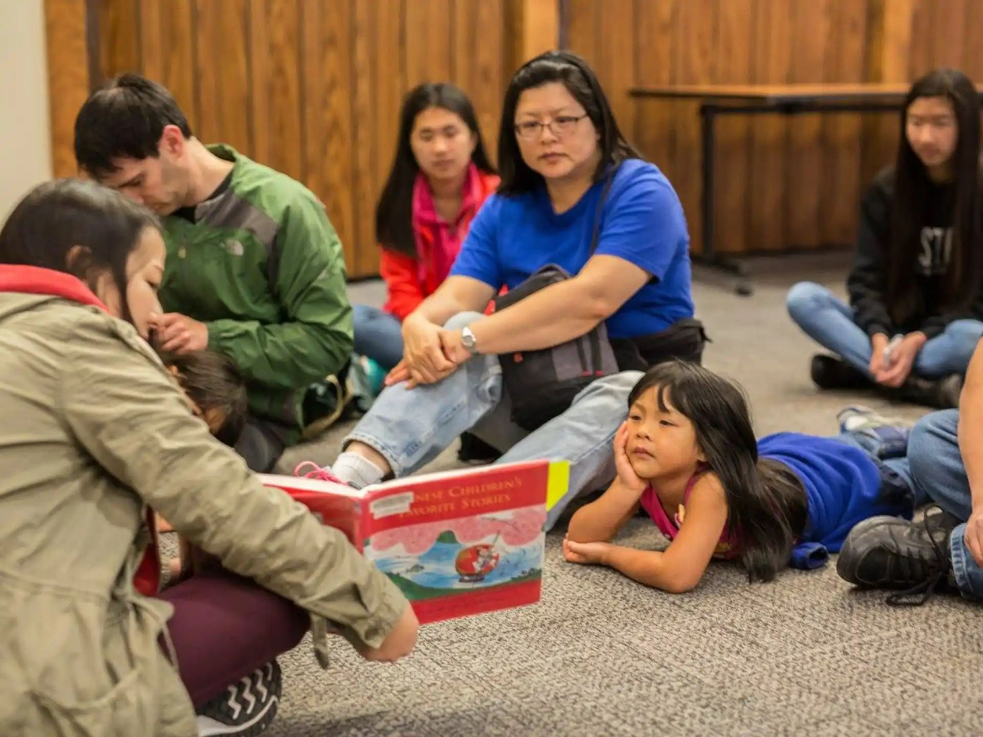 a group of people sitting on the floor