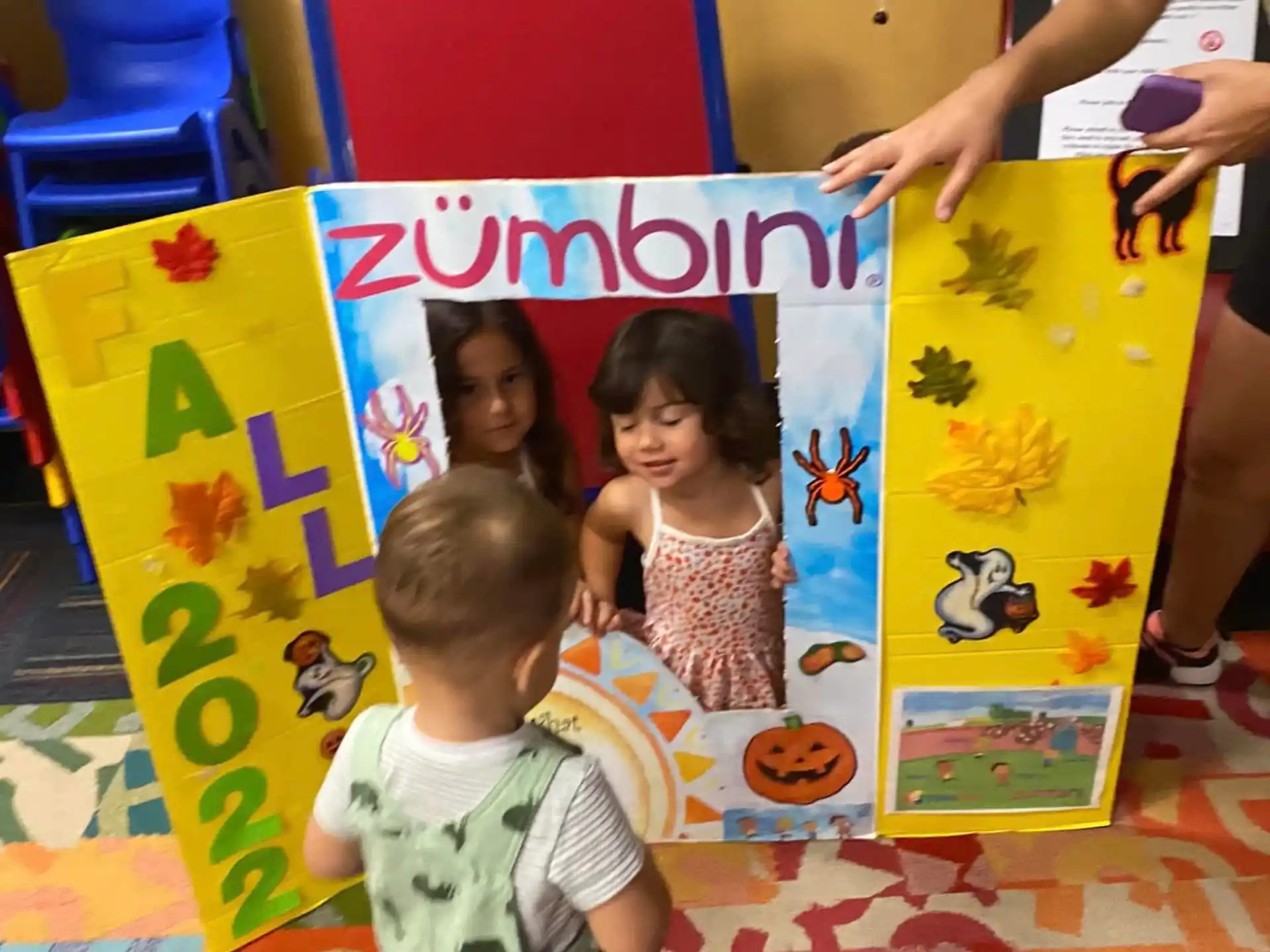 children playing with a book