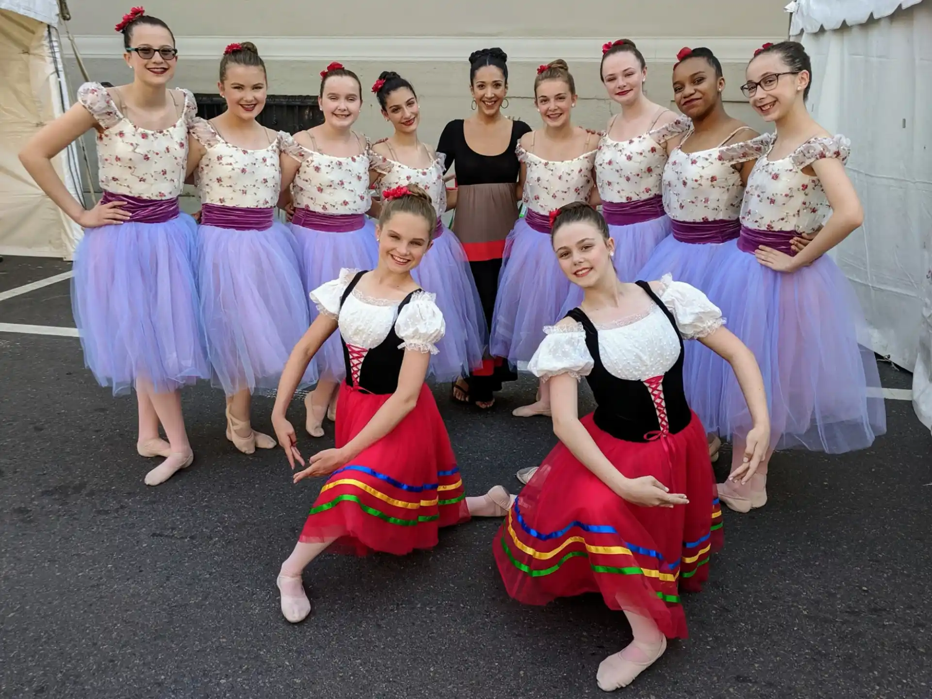 a group of women in dresses