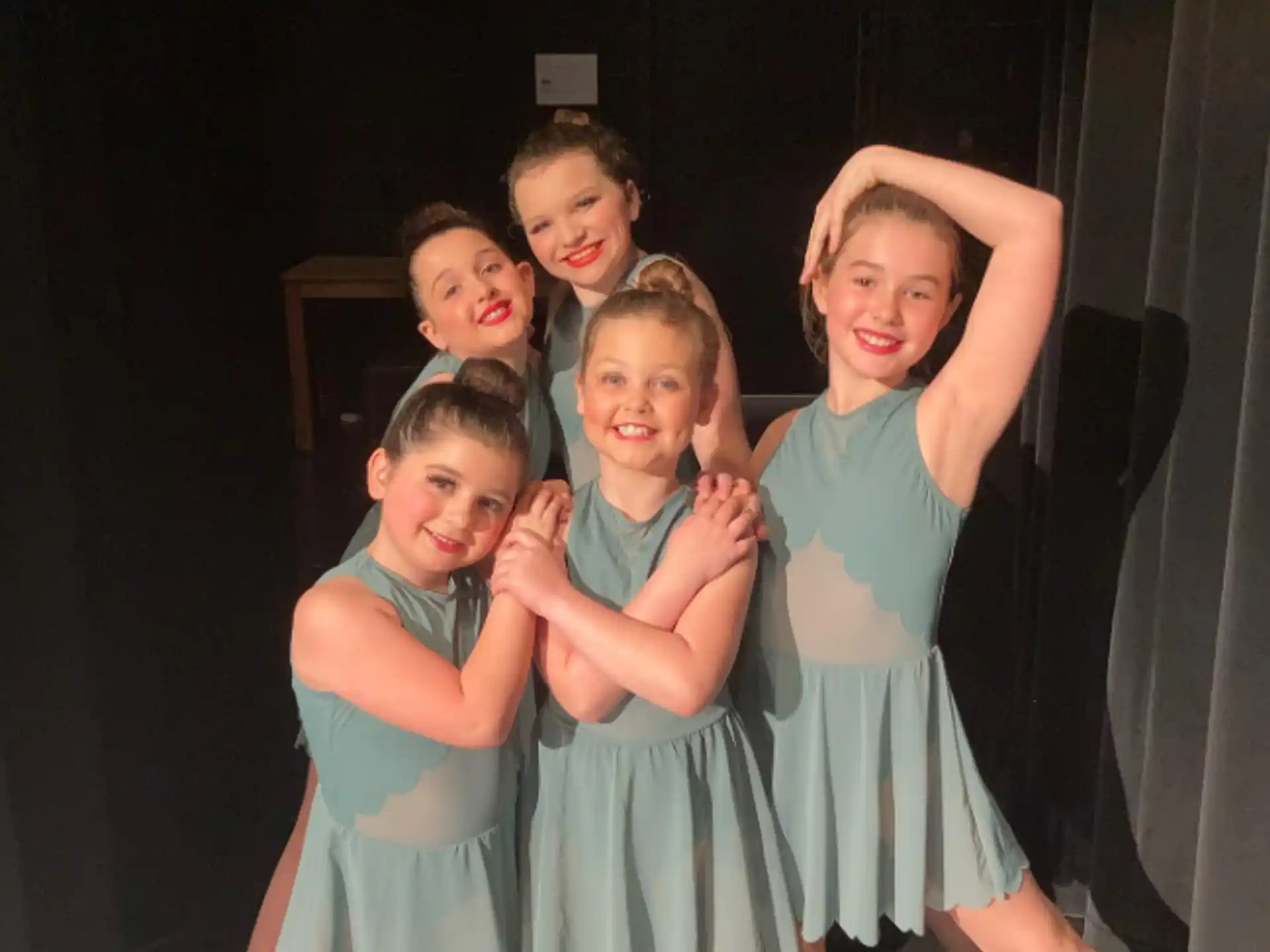 a group of children in dresses