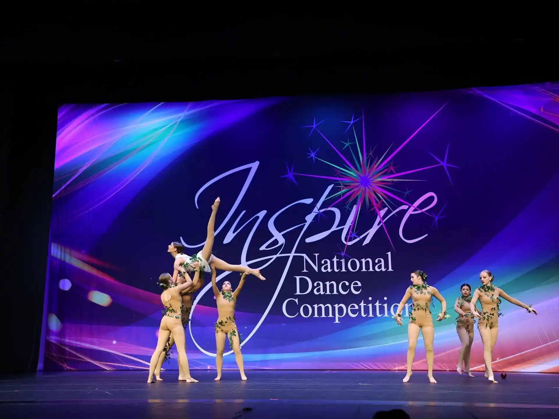 a group of women dancing on a stage