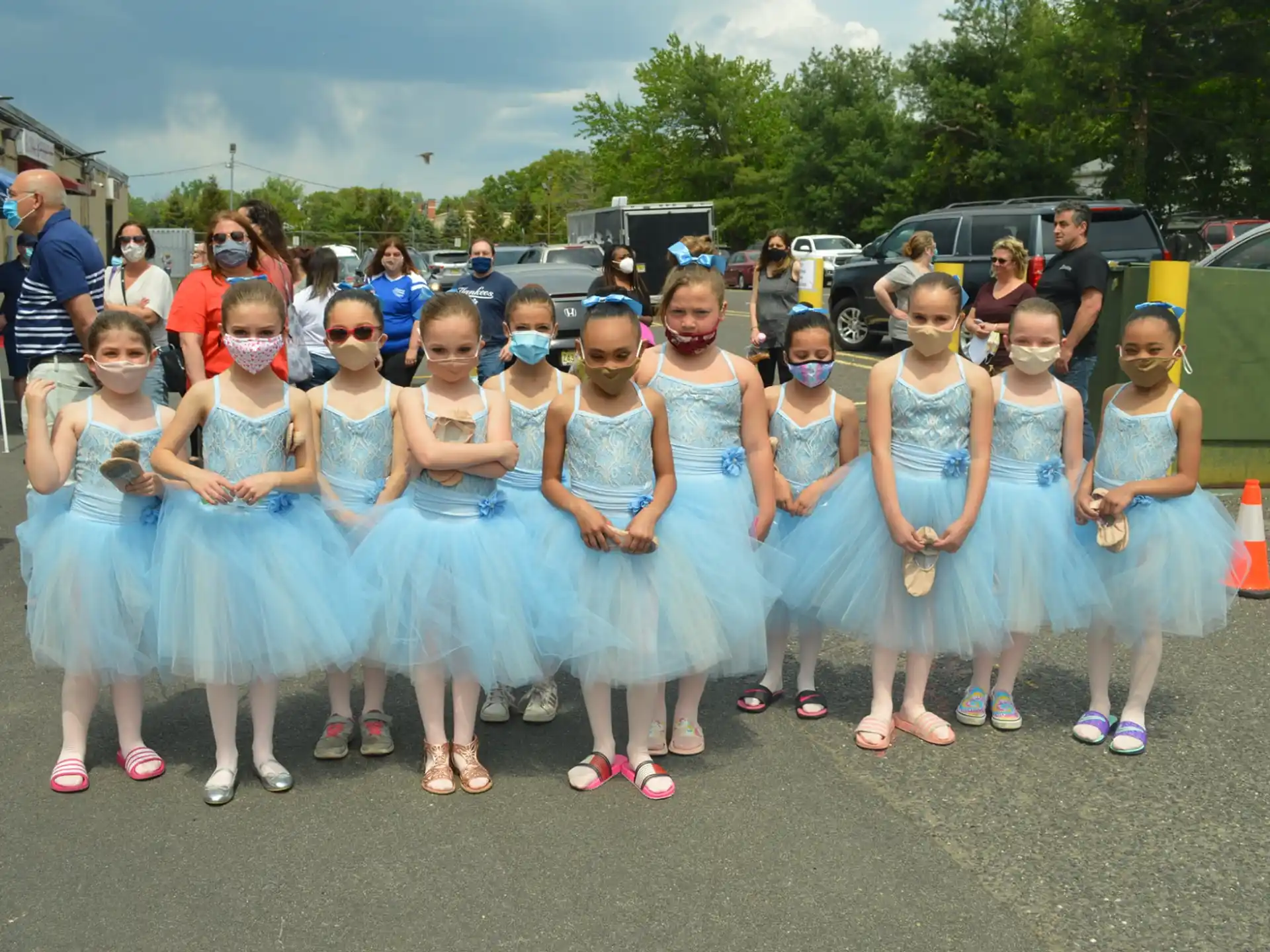 a group of girls in matching outfits