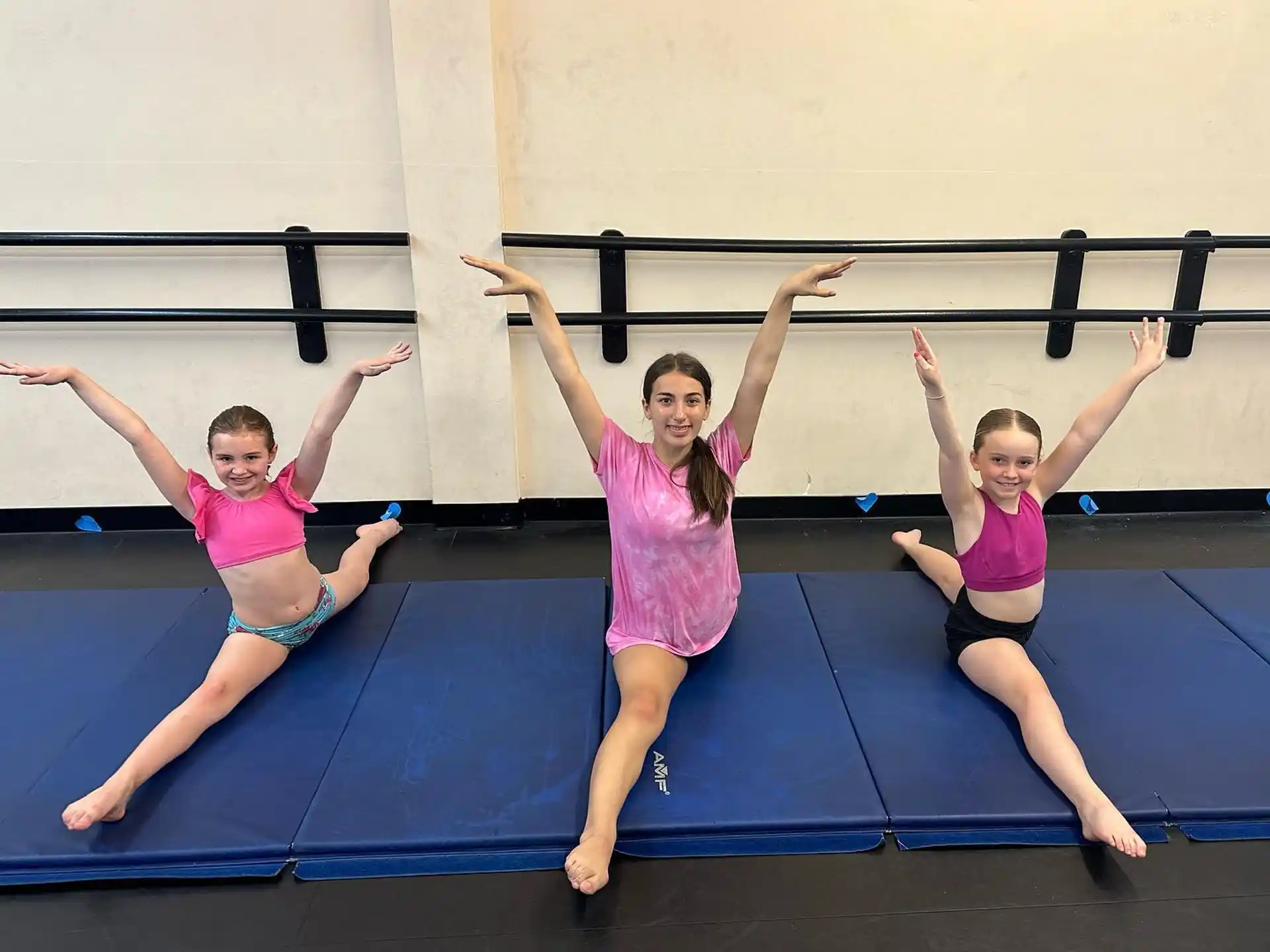 a group of girls posing for a photo