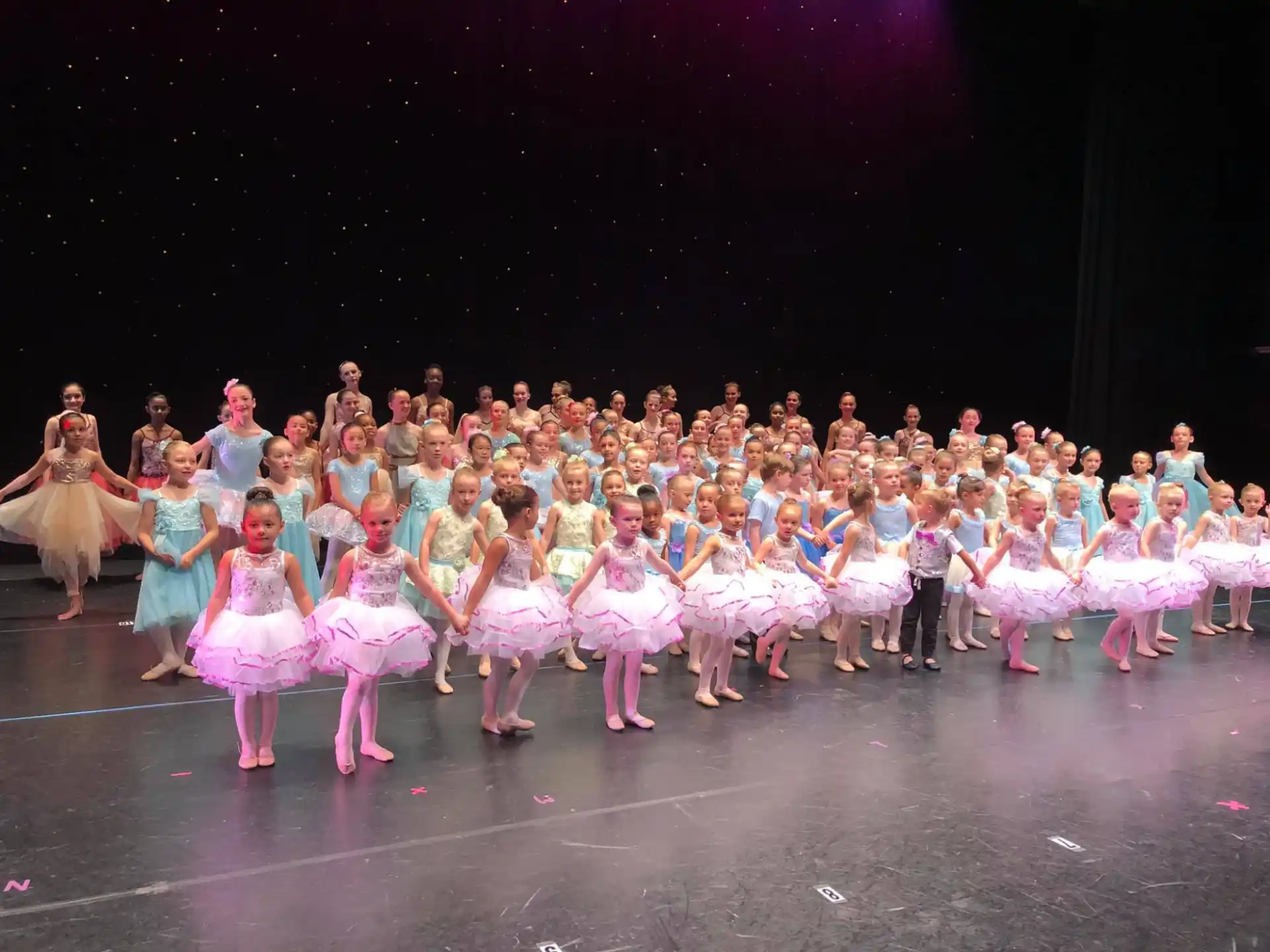 a group of people performing on stage
