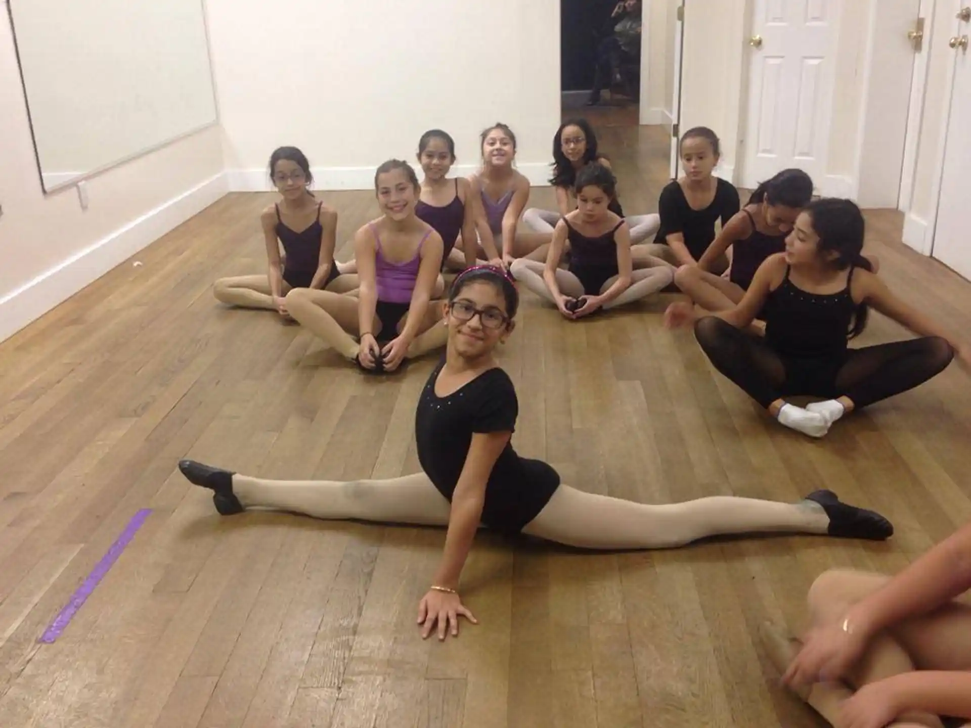 a group of people sitting on the floor