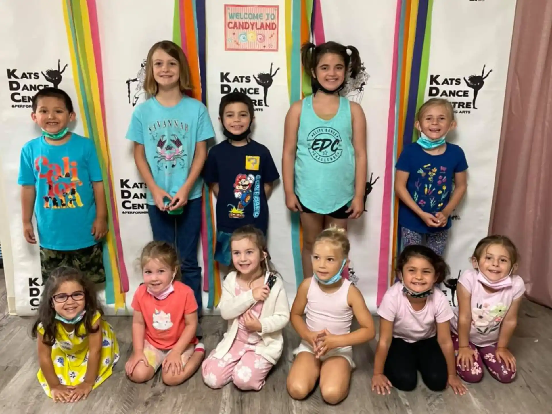 a group of kids posing for a photo
