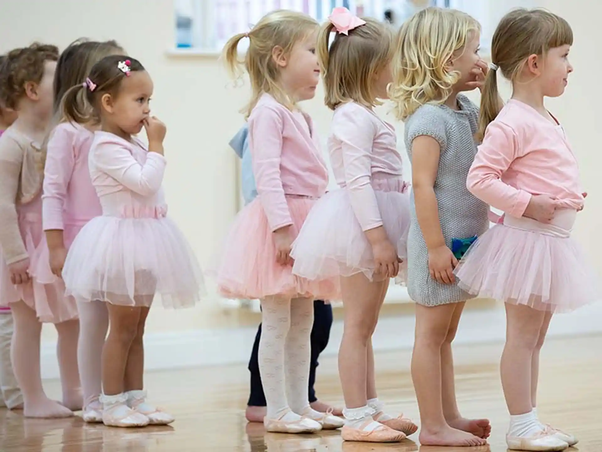a group of girls in matching outfits