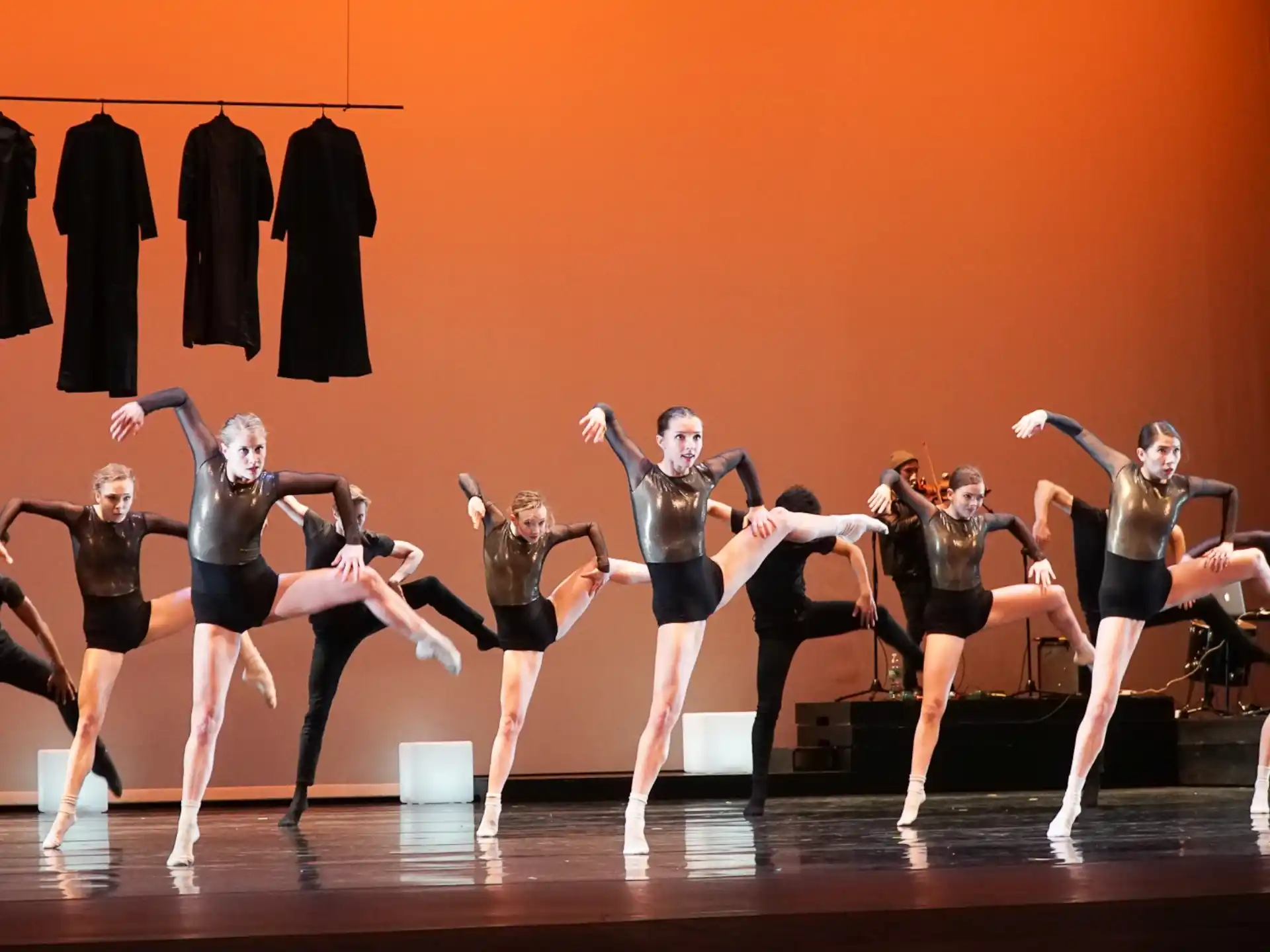 a group of women dancing on a stage