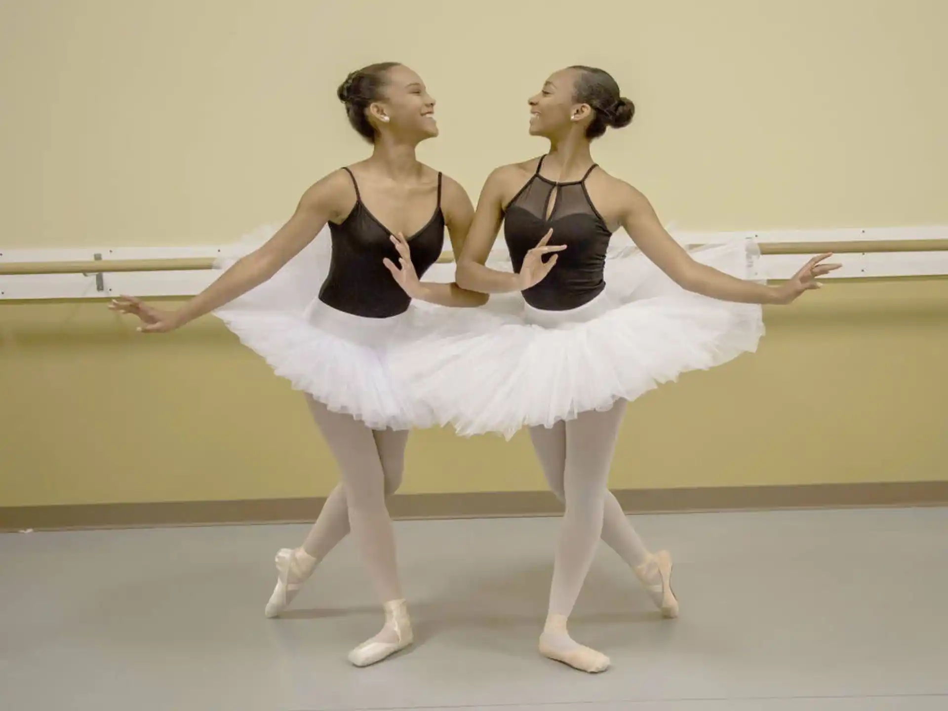 two women dancing on a stage