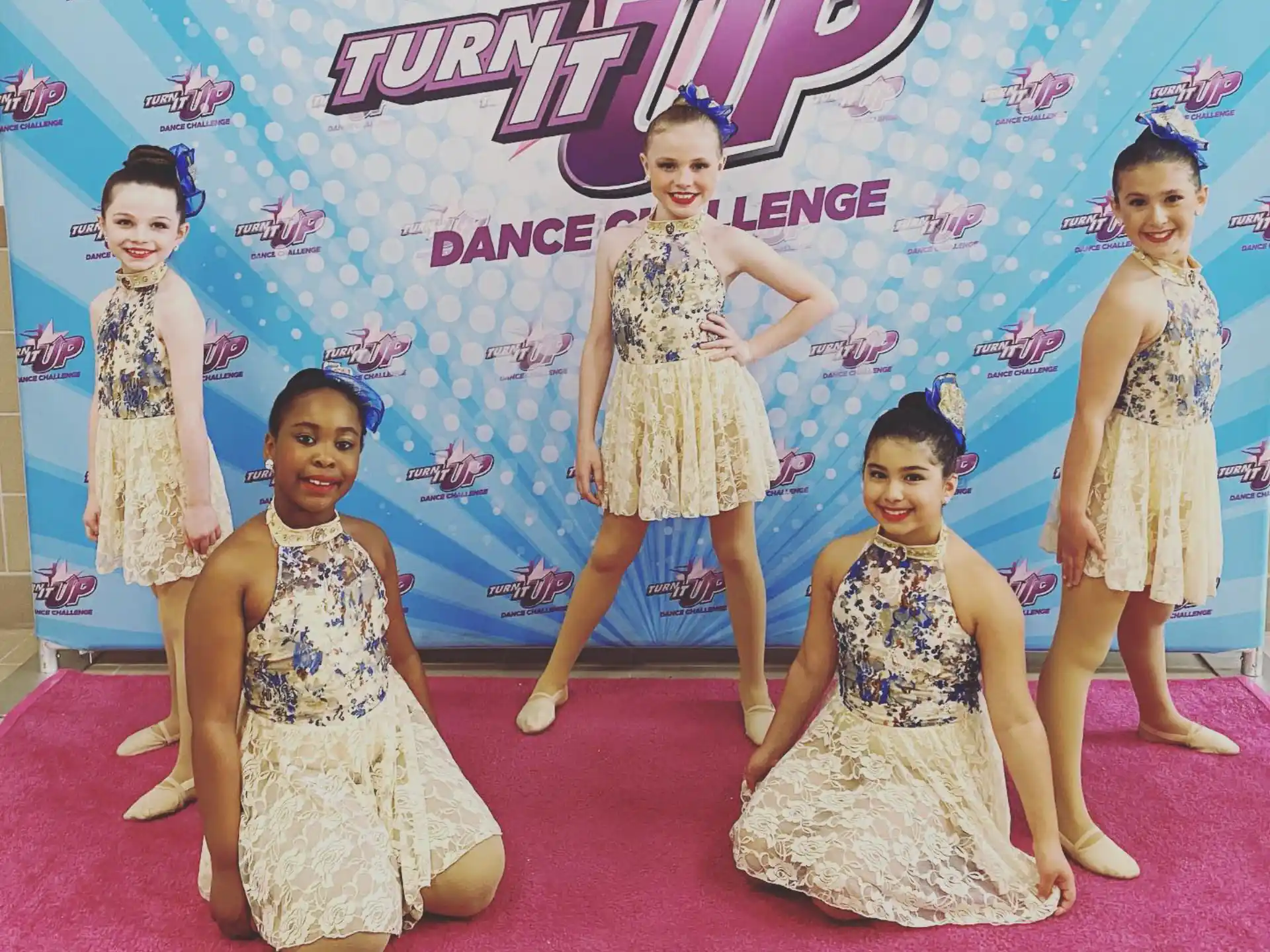 a group of girls posing for a picture