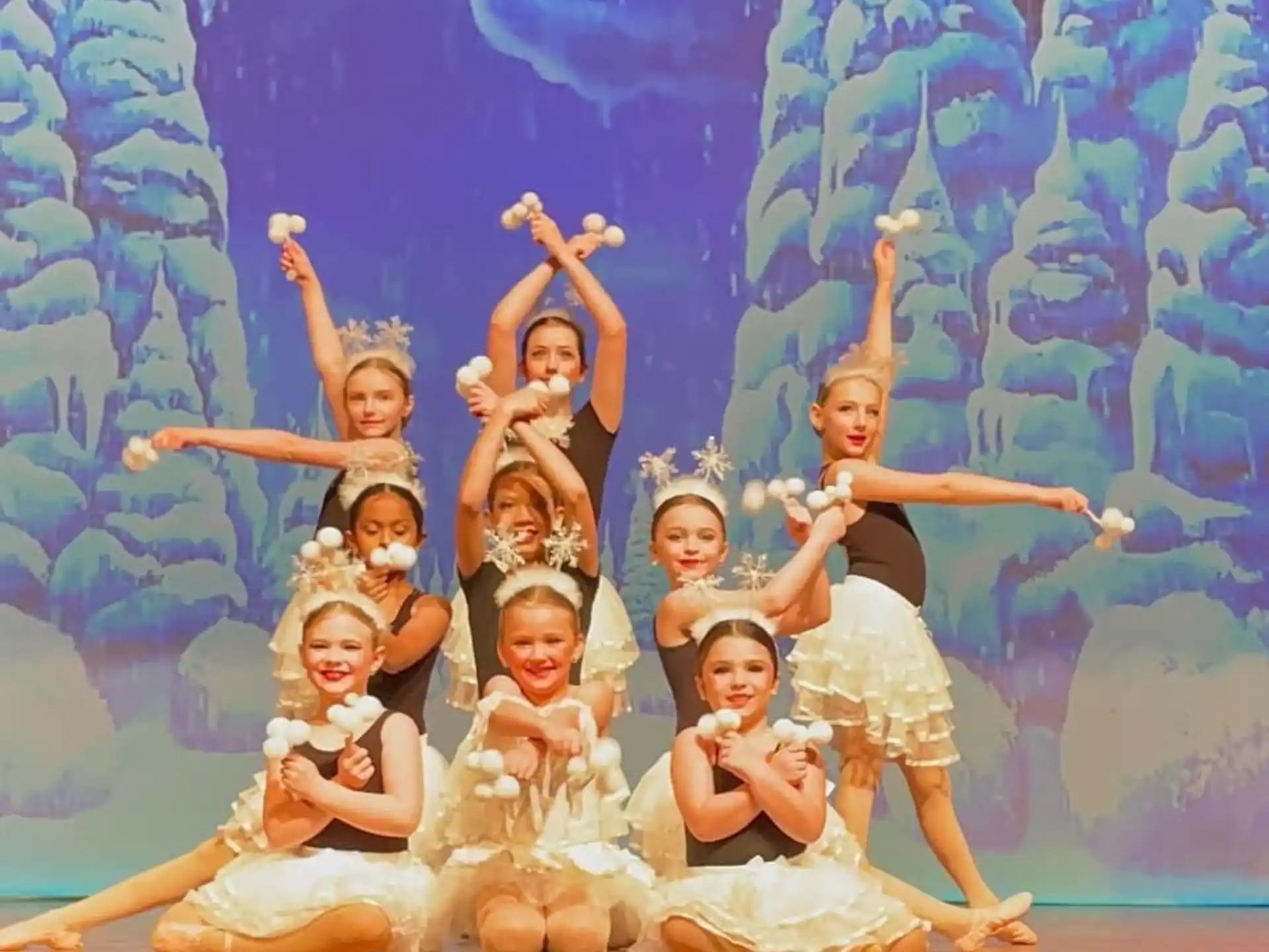 a group of children in white dresses