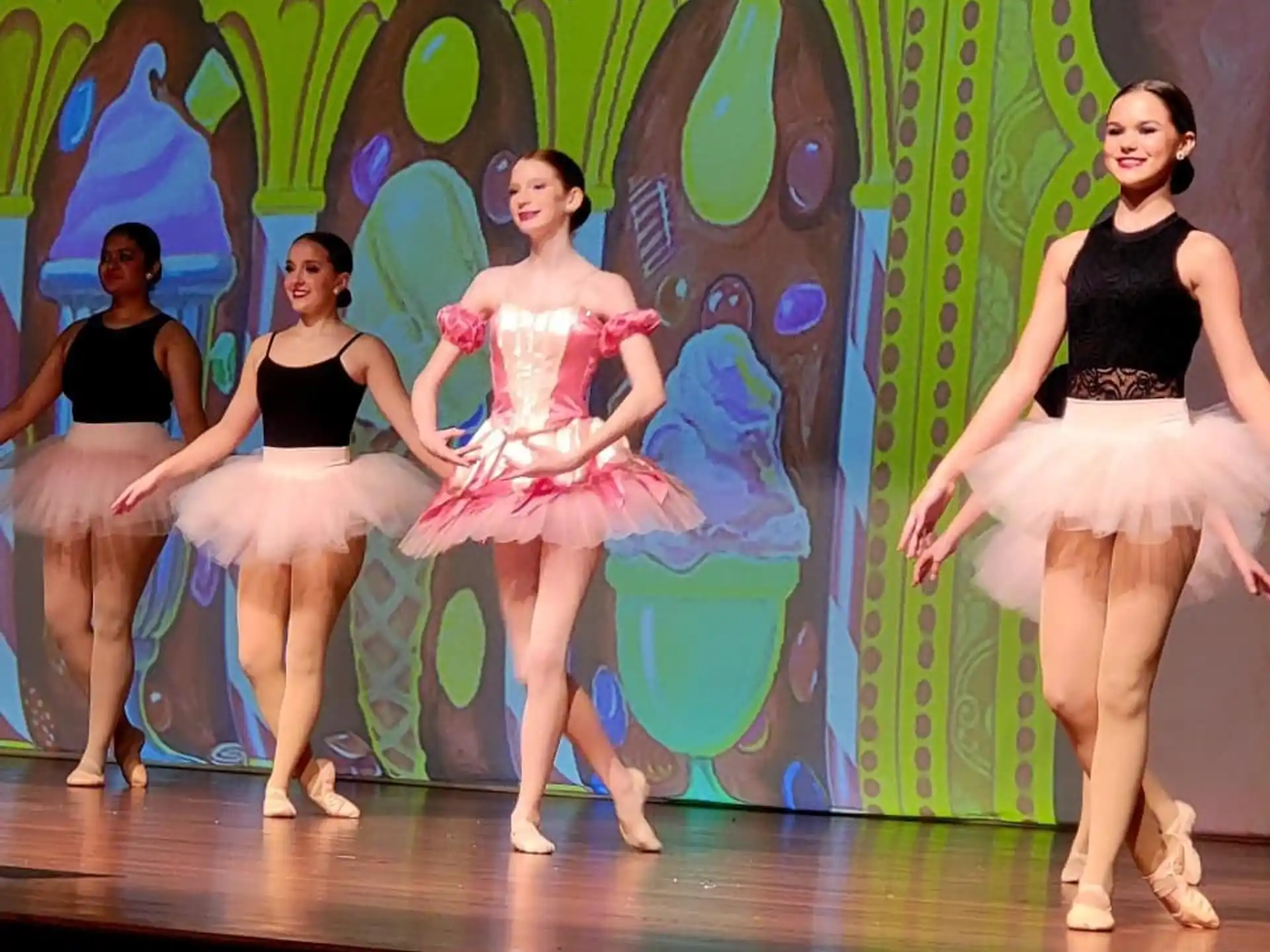 a group of women dancing on a stage