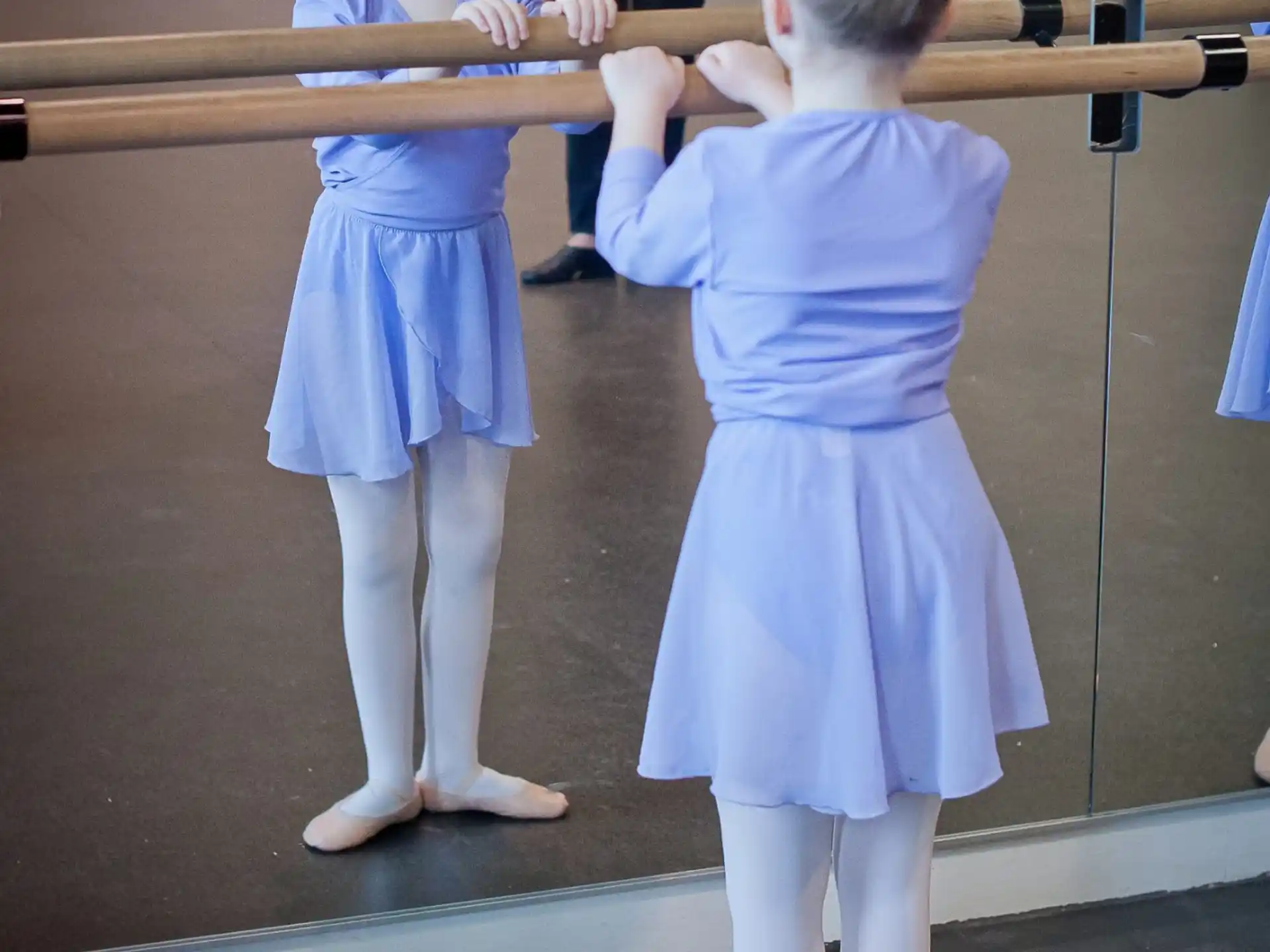 a couple of girls in blue dresses