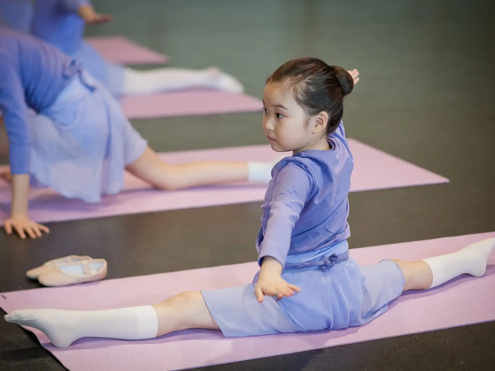 a young girl doing yoga