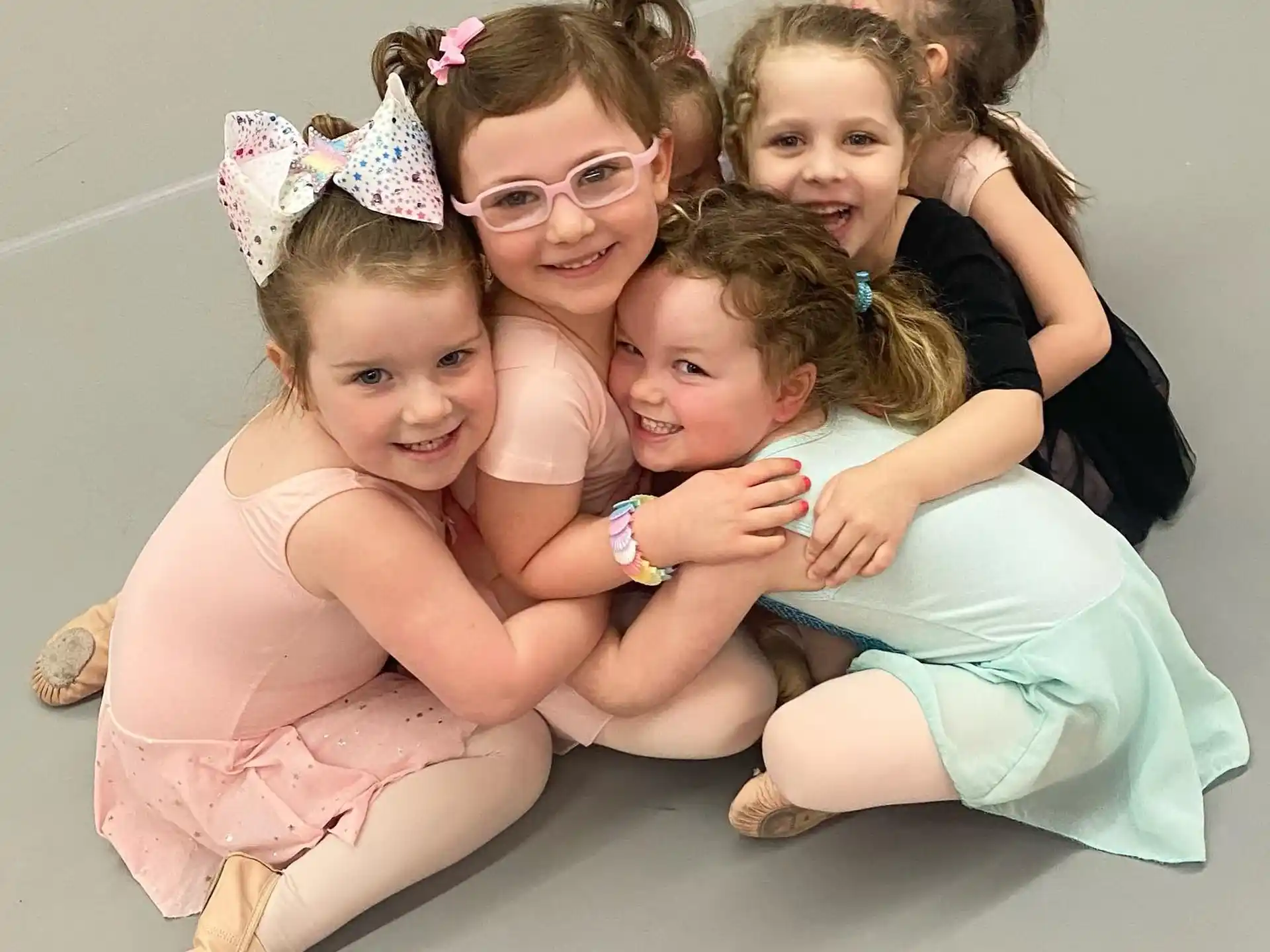 a group of girls posing for a photo