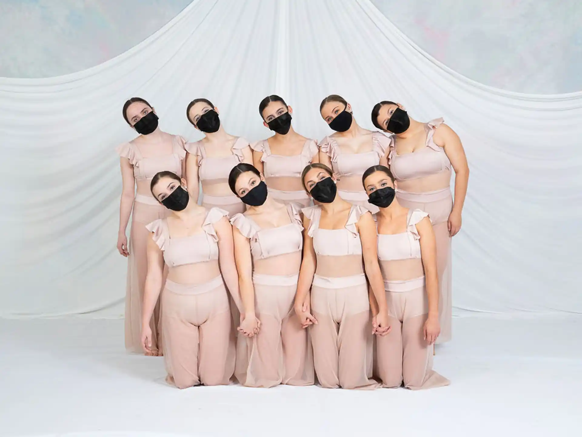 a group of people wearing white