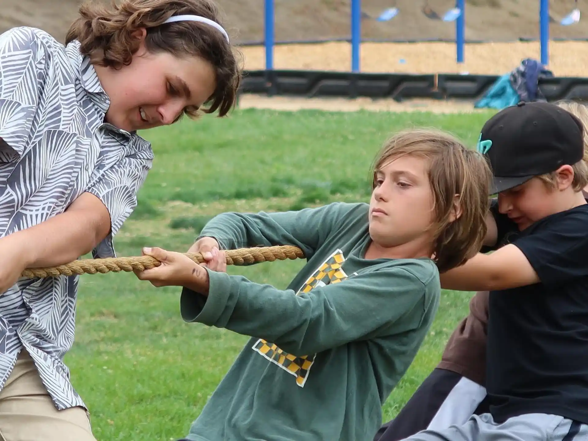 a group of people holding a snake