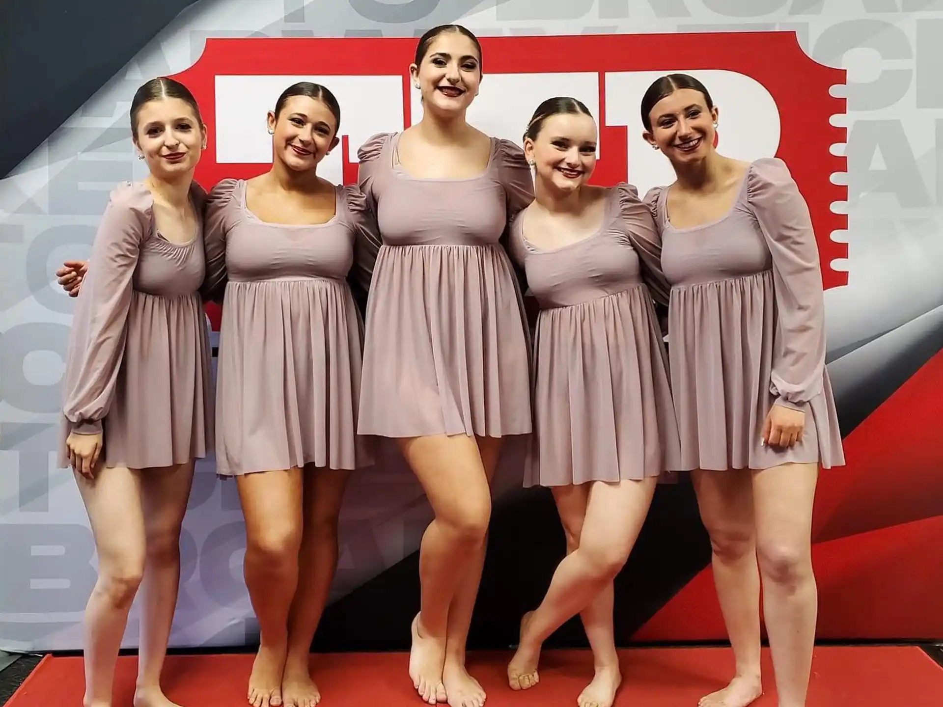 a group of women posing for a photo