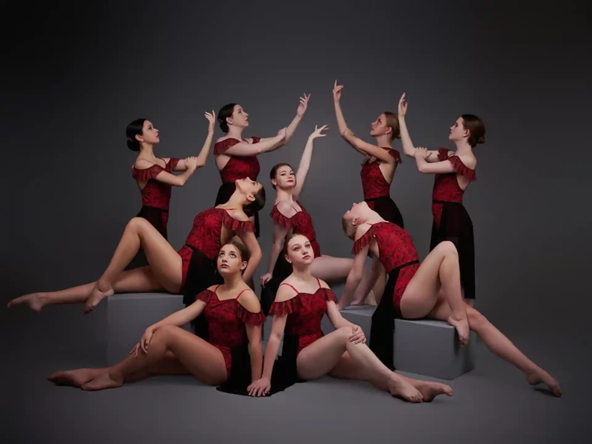 a group of women in red and black dancing