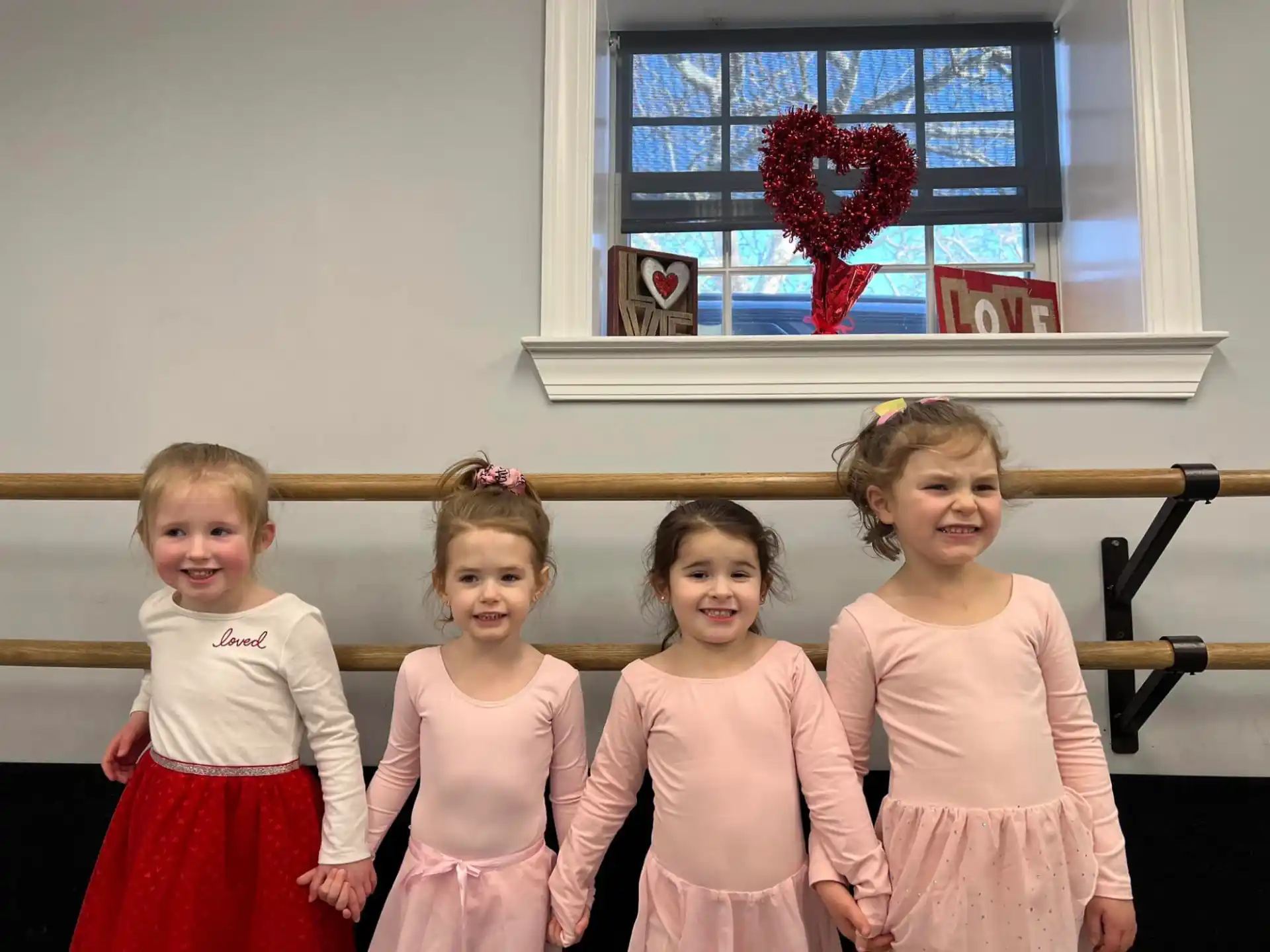 a group of girls in dresses