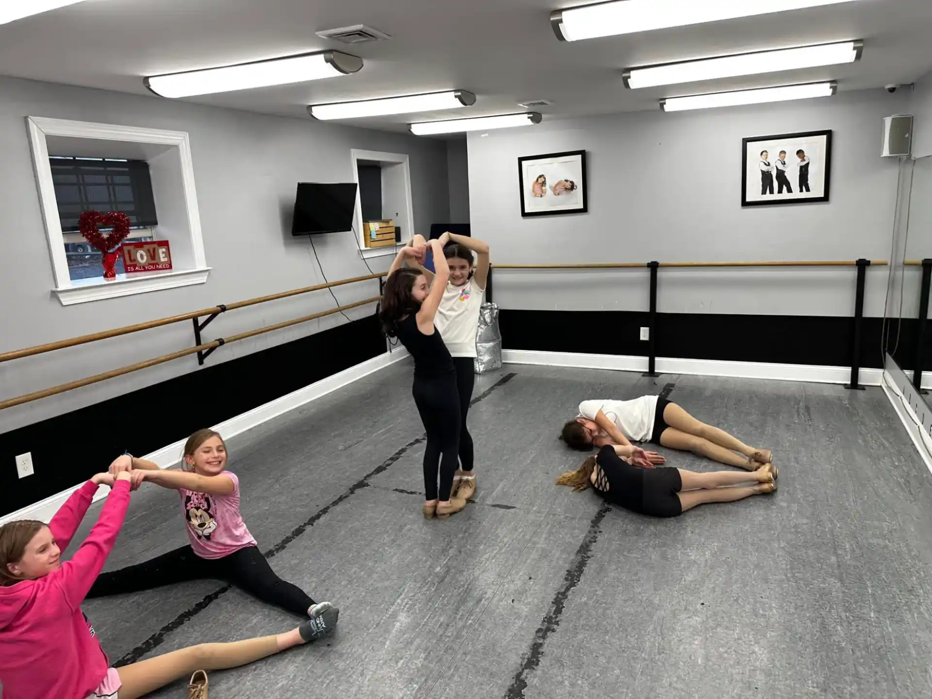 a group of people exercising in a room