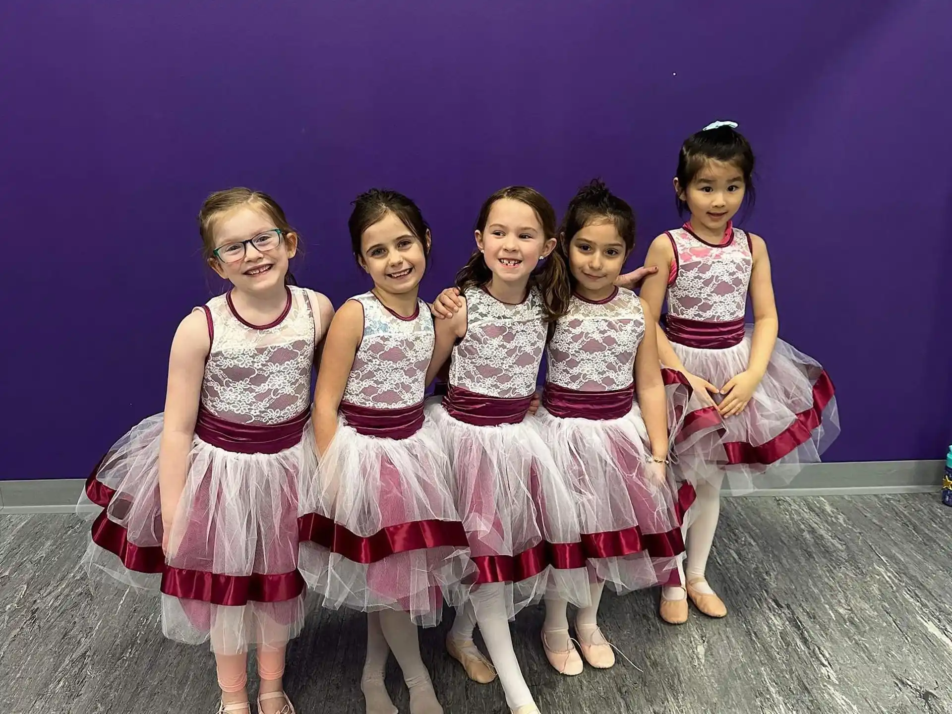 a group of girls posing for a photo