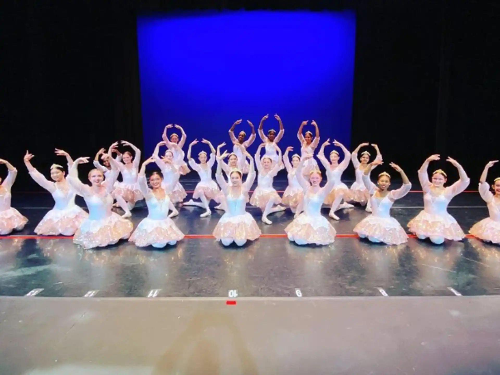 a group of people in white clothing