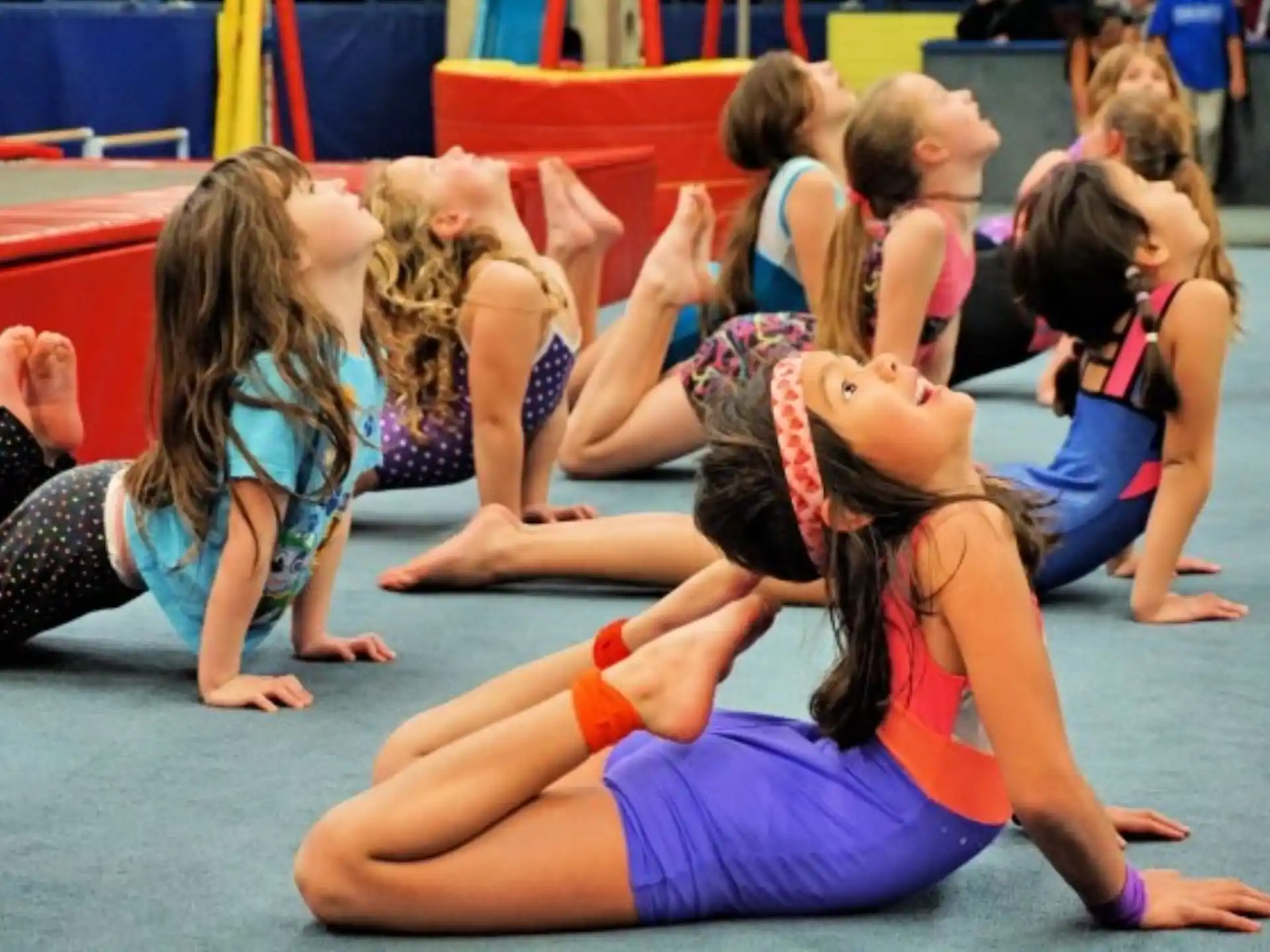 a group of girls doing yoga