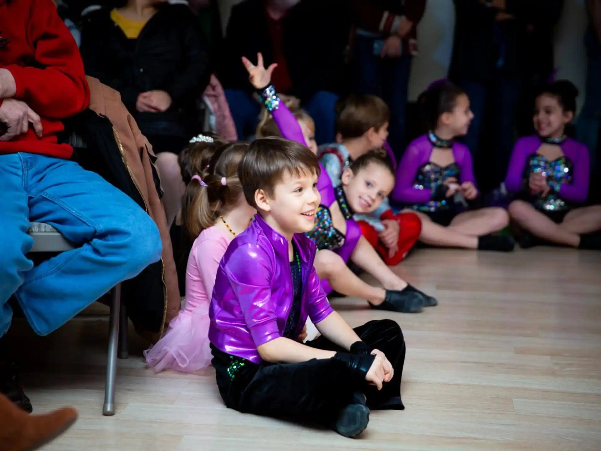 a group of children sitting on the floor